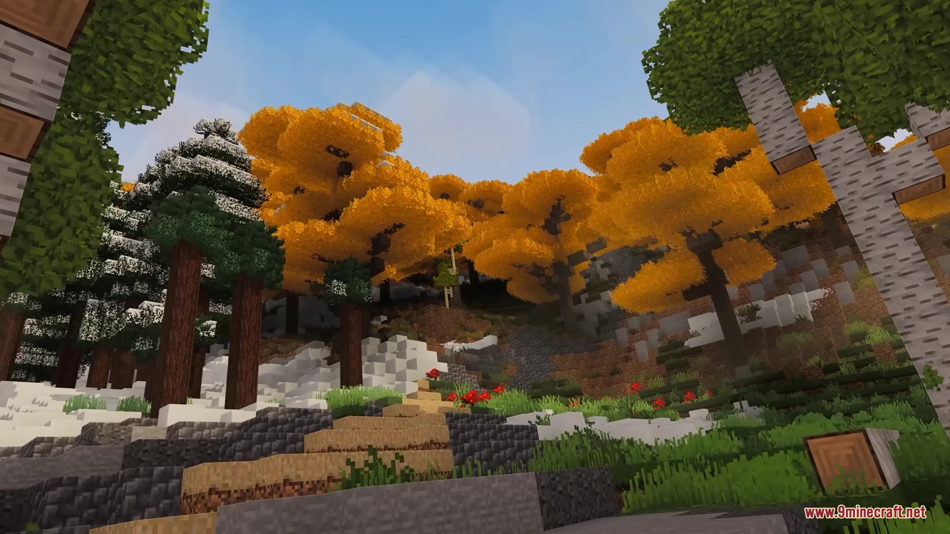 Golden ginkgo trees and a stone path on a snowy Minecraft hillside