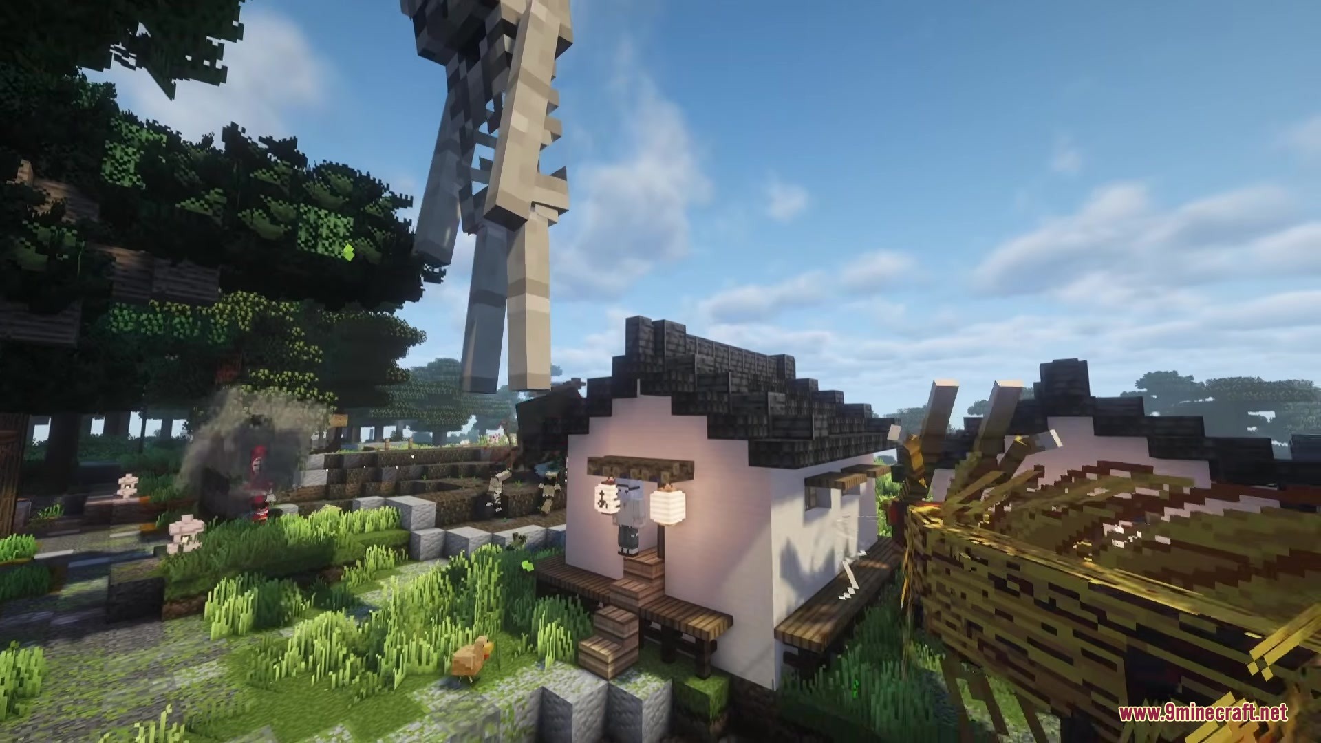 A giant mythical skeleton looms over a traditional Japanese house in the woods