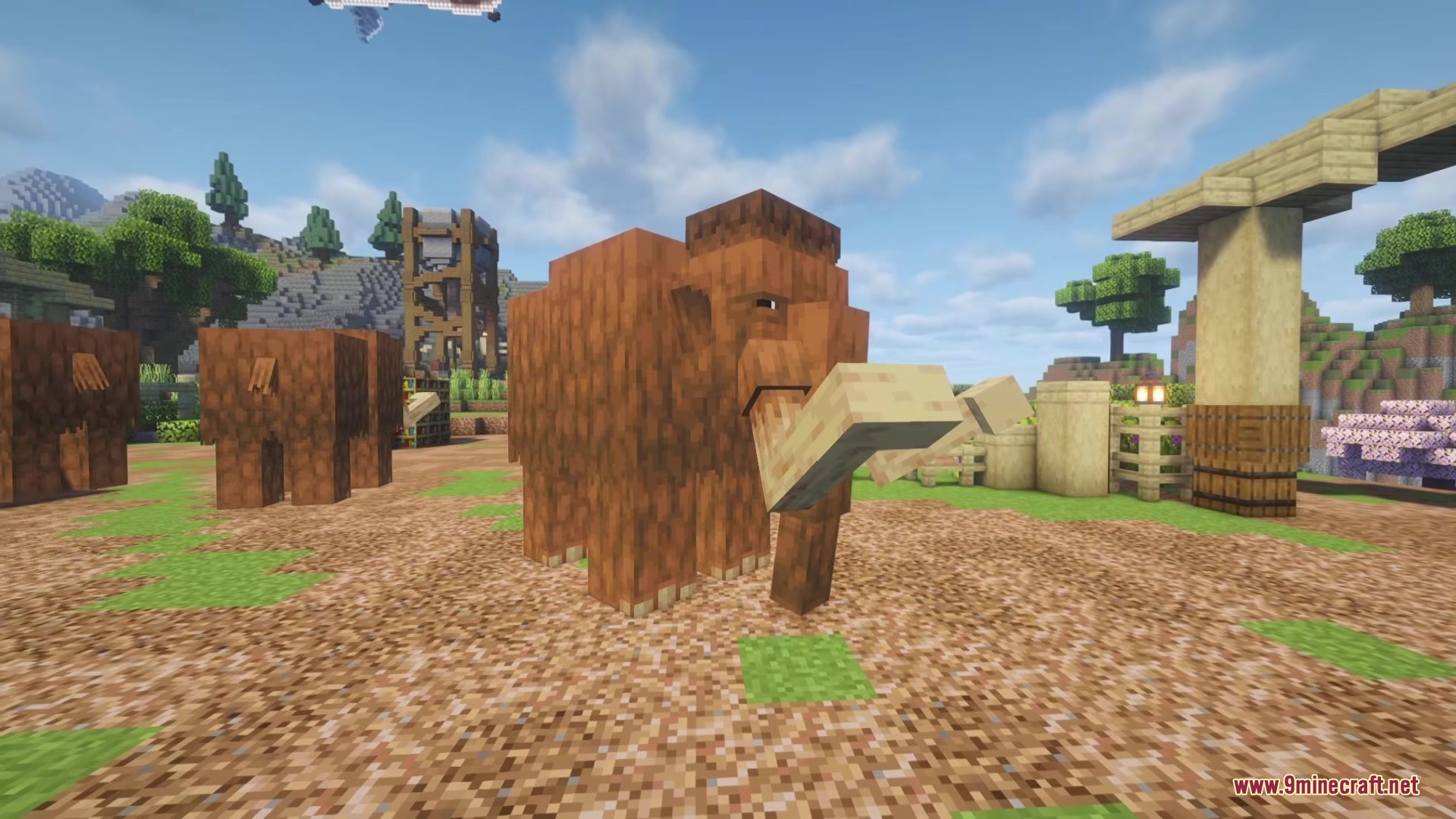 Shinea L's Prehistoric Expansion Mod Screenshot 1 A large Woolly Mammoth stands in a field with other mammoths nearby