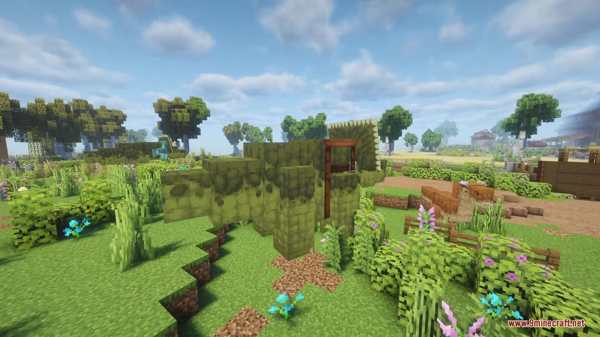 Shinea L's Prehistoric Expansion Mod Screenshot 6 Side profile of a green Triceratops standing in a grassy Minecraft landscape