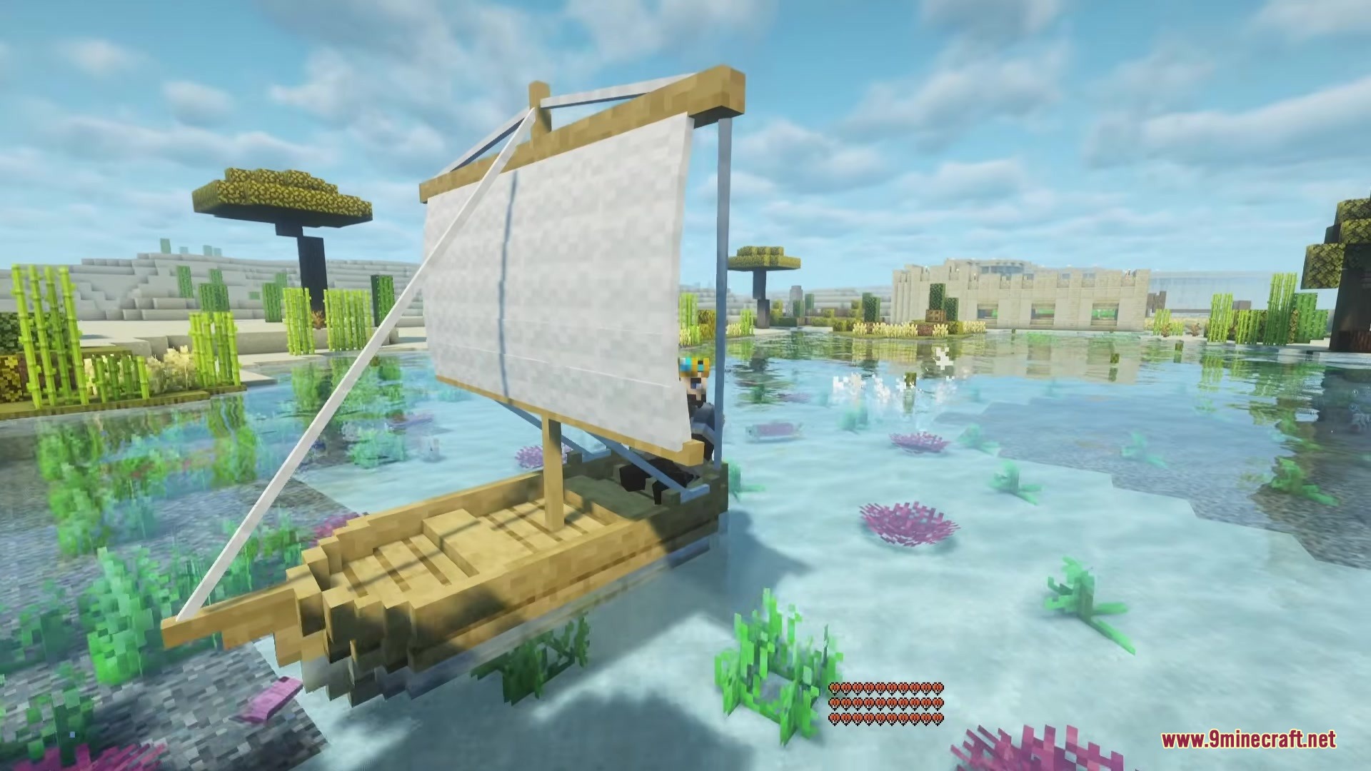 Shippy Ships Mod Screenshot 4 A wooden sailboat with a white sail travels across clear water over coral reefs