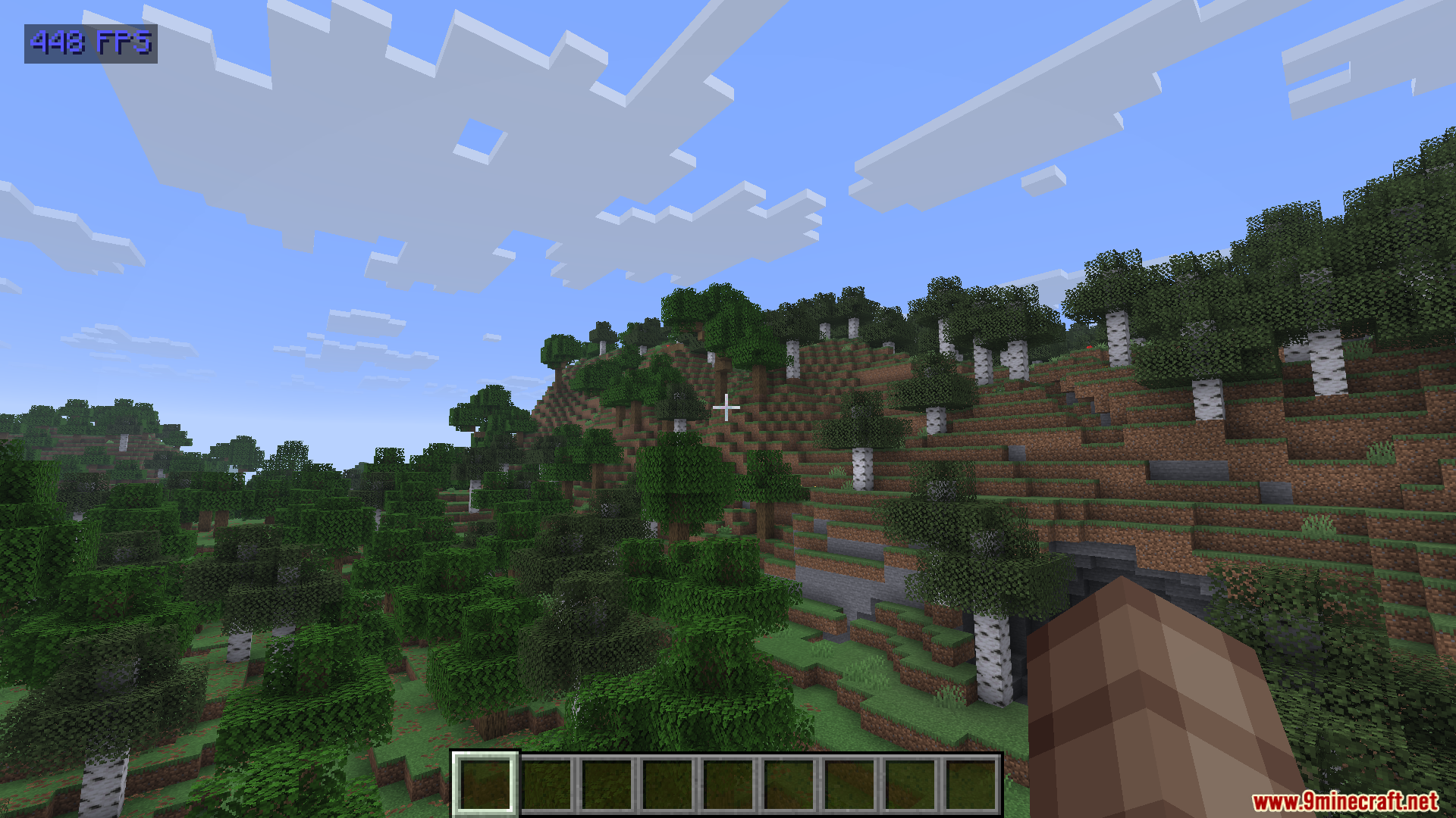 Show FPS Mod Screenshot 4 High frame rate counter shown over a lush Minecraft forest and hills