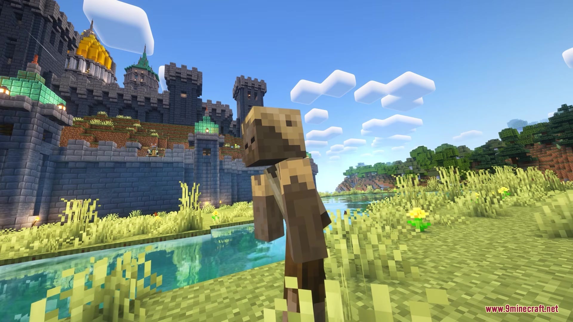 Siegeweapons Mod Screenshot 7 A character in medieval clothing stands near a river and a large castle