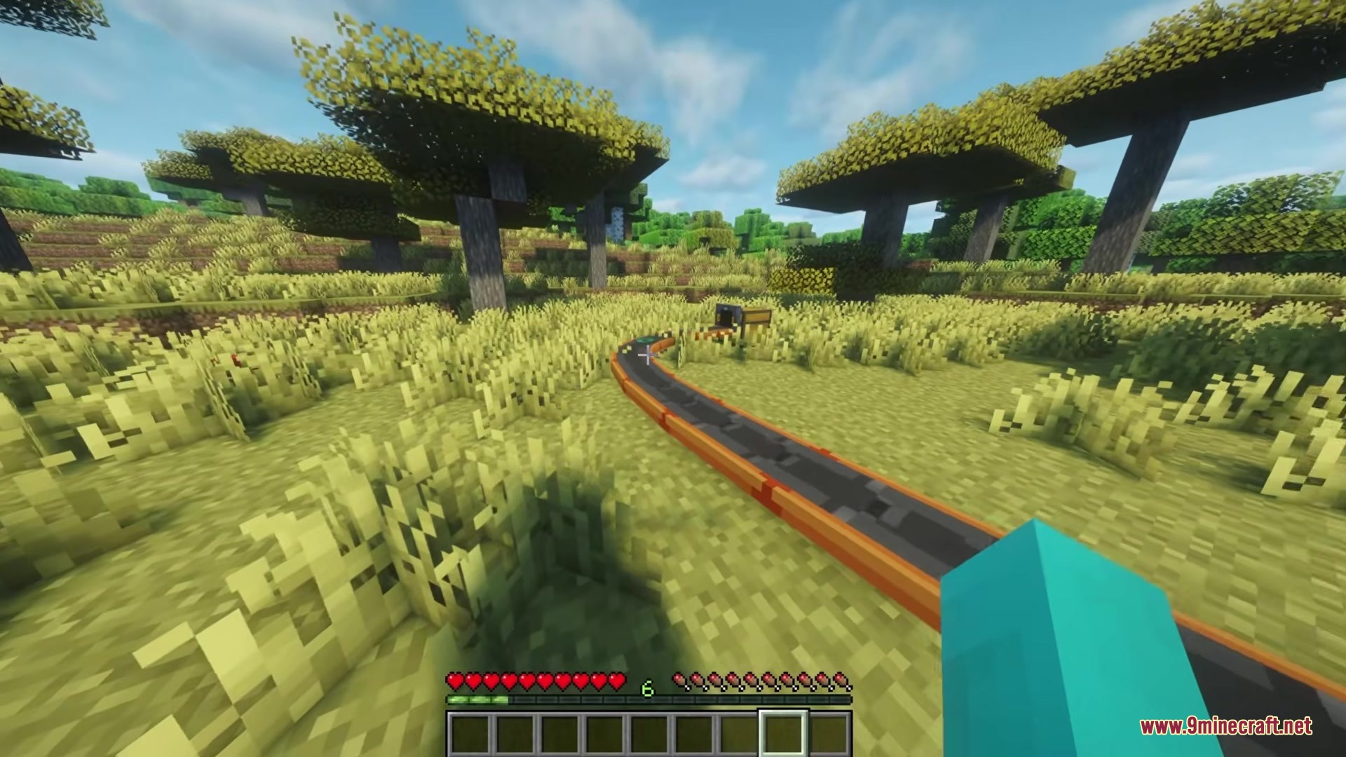 Simple Conveyor Belts Mod Screenshot 4 A winding conveyor belt path moving items towards a chest in the distance