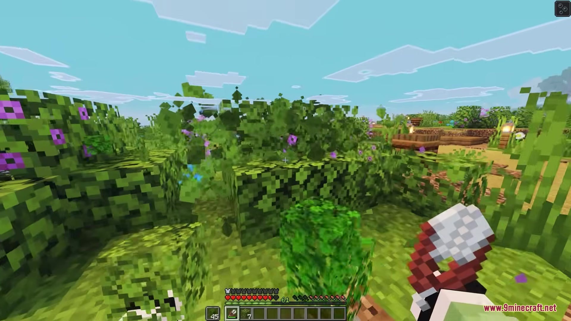 Simple Swap Mod Screenshot 6 A player holds shears while standing in front of flowering leaf blocks
