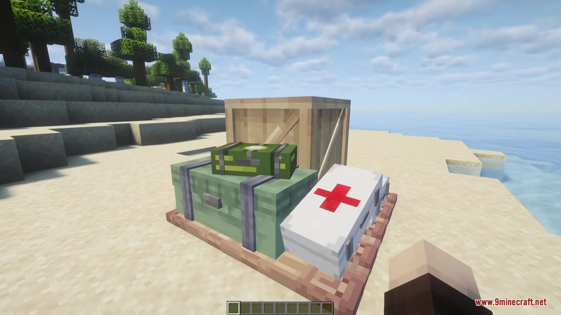 Simply Airdrops Mod Screenshot 1 Various supply crates like medical and weapon boxes sitting on the sandy shore