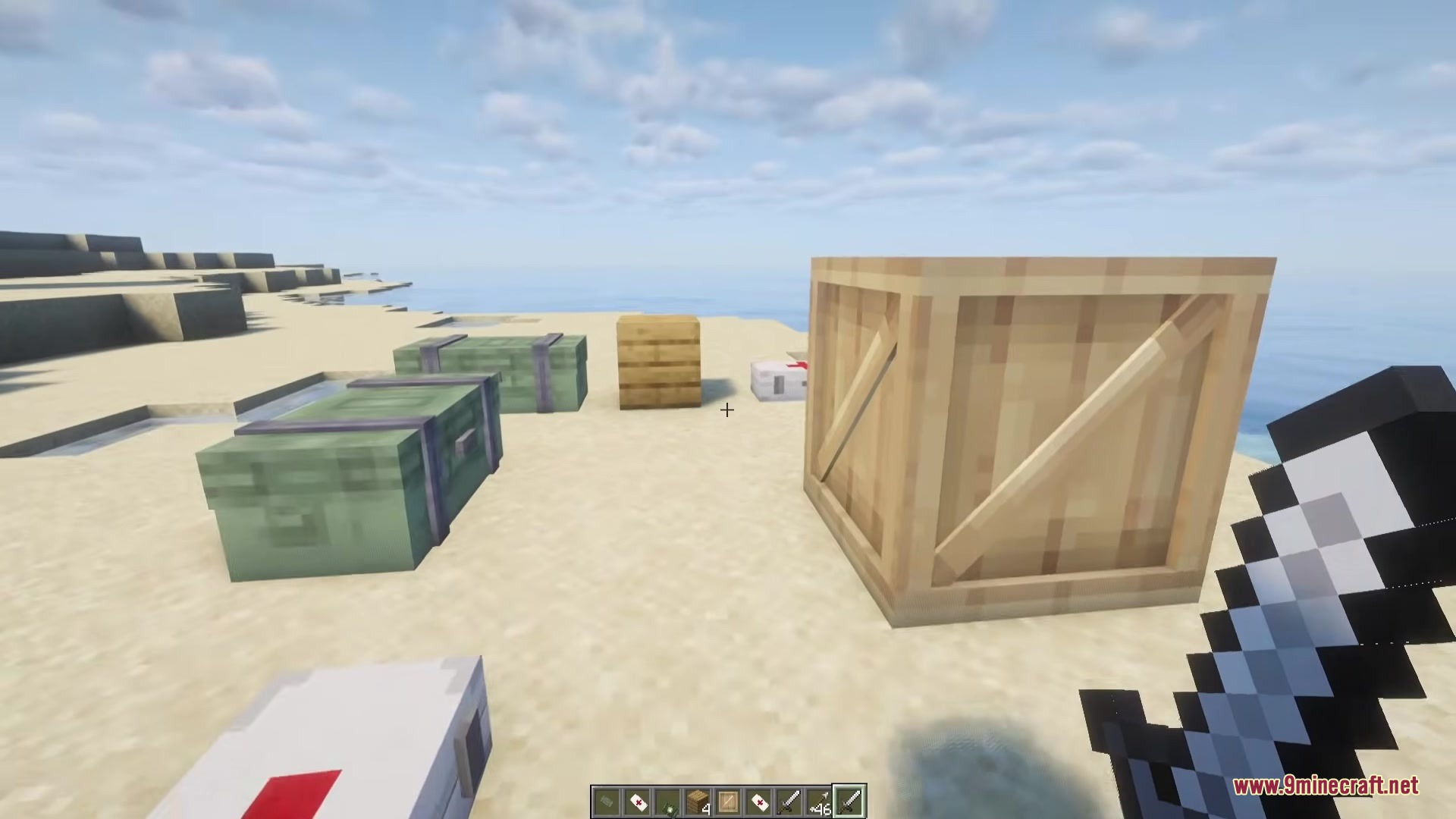 Simply Airdrops Mod Screenshot 5 A player standing near various Simply Airdrops Mod crates on a beach