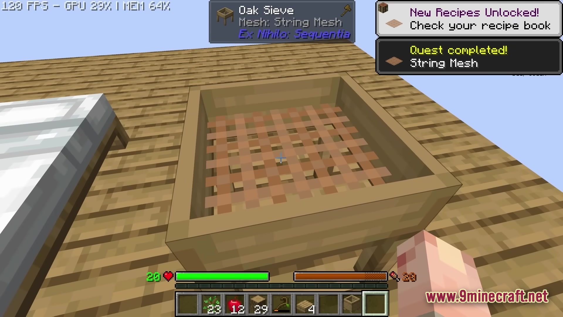 An Oak Sieve with a String Mesh placed on a wooden platform in a skyblock world