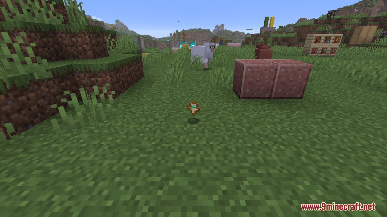Smaller Totems Resource Pack Screenshot 10 A small Totem of Undying item floating above the grass in Minecraft world
