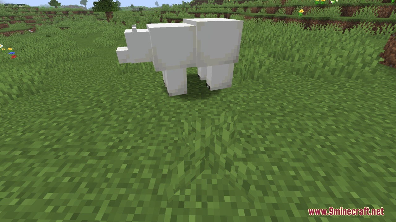 Smooth Entity Shadows Resource Pack Screenshot 5 A polar bear stands on green grass with a soft round shadow