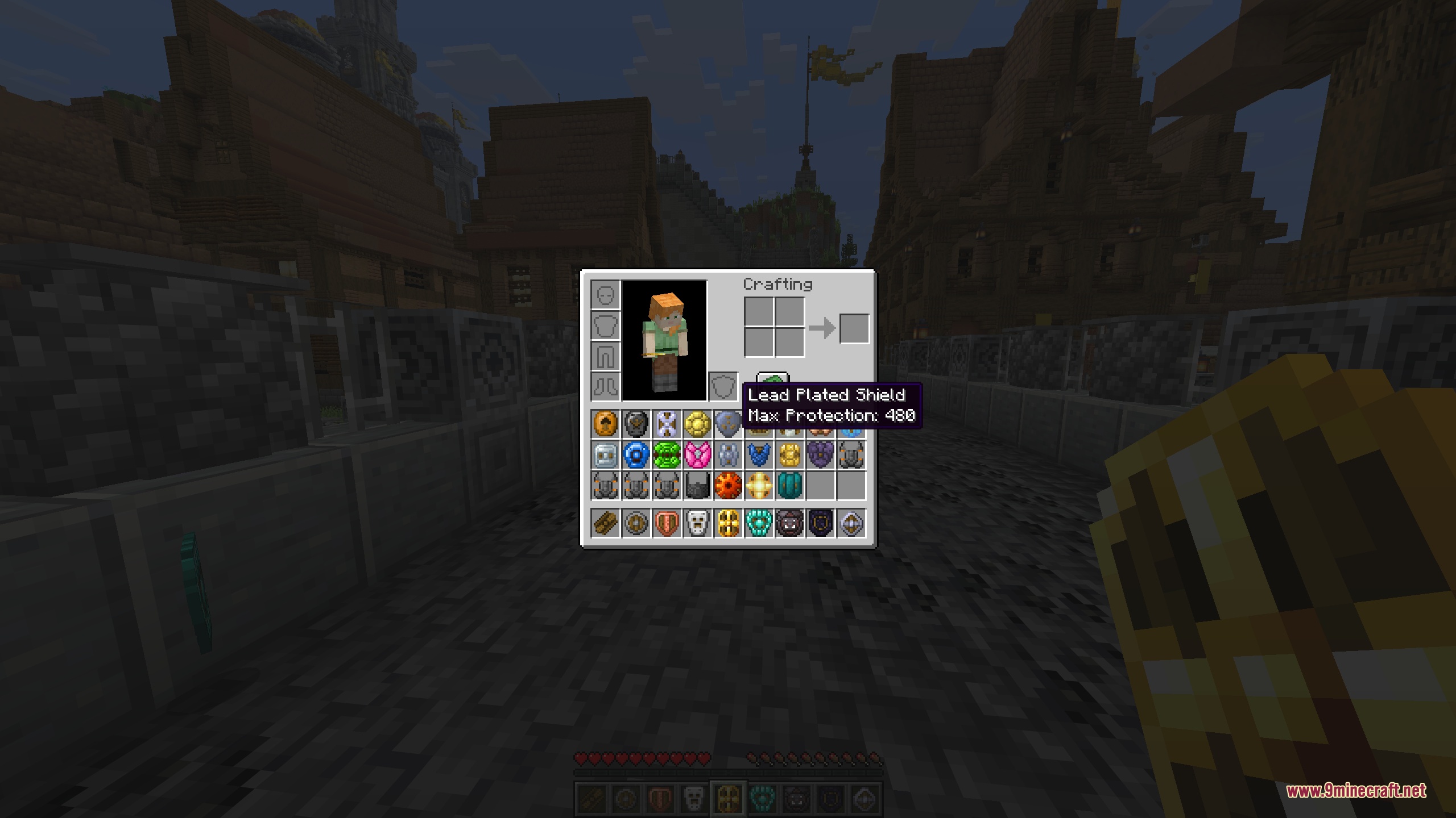 The survival inventory open on a medieval town street, showing the large collection of new shields with a tooltip for the Lead Plated Shield reading a Max Protection of 480, while the player holds a shield in the off-hand