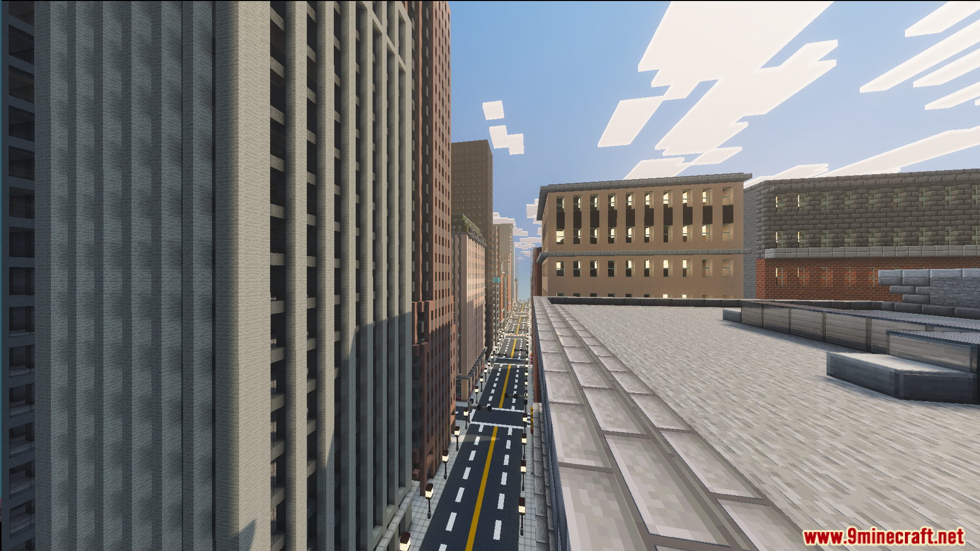 SpiderMan City Map Screenshot 9 View from a rooftop overlooking tall skyscrapers and a long city road