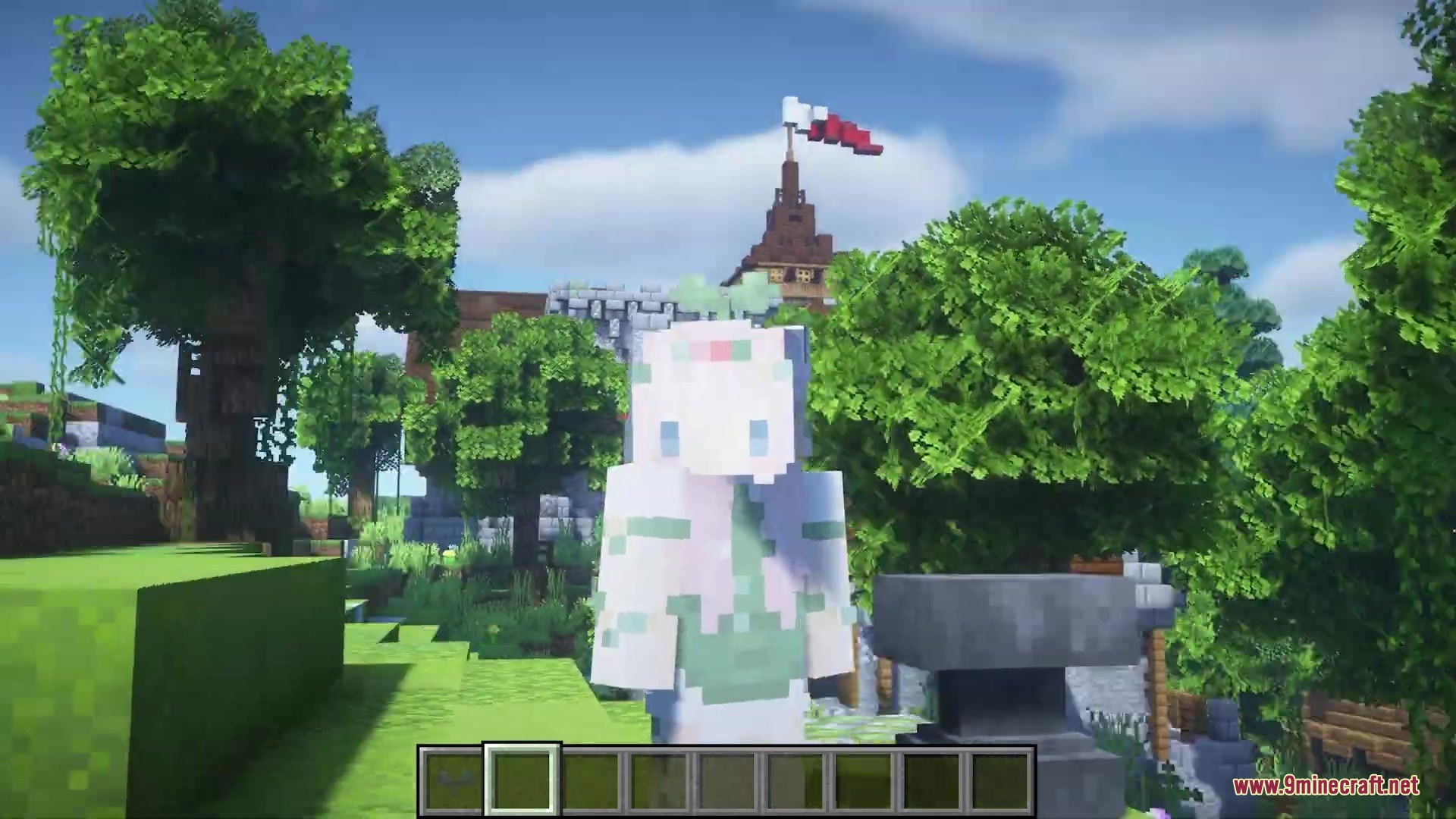 Player wearing a green sprout hat standing in a sunny Minecraft world