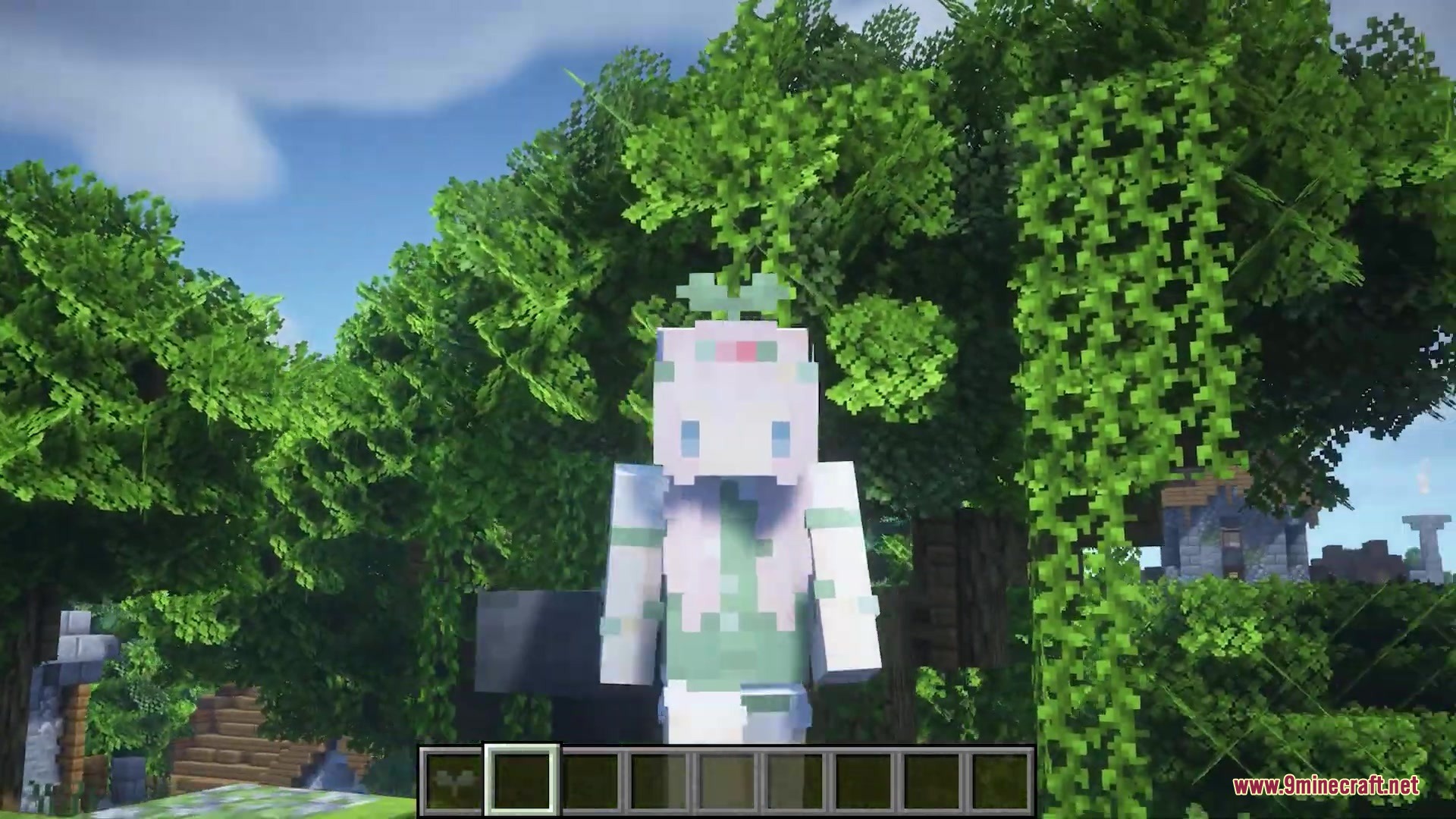 Player character standing in a lush forest with a tiny sprout hat