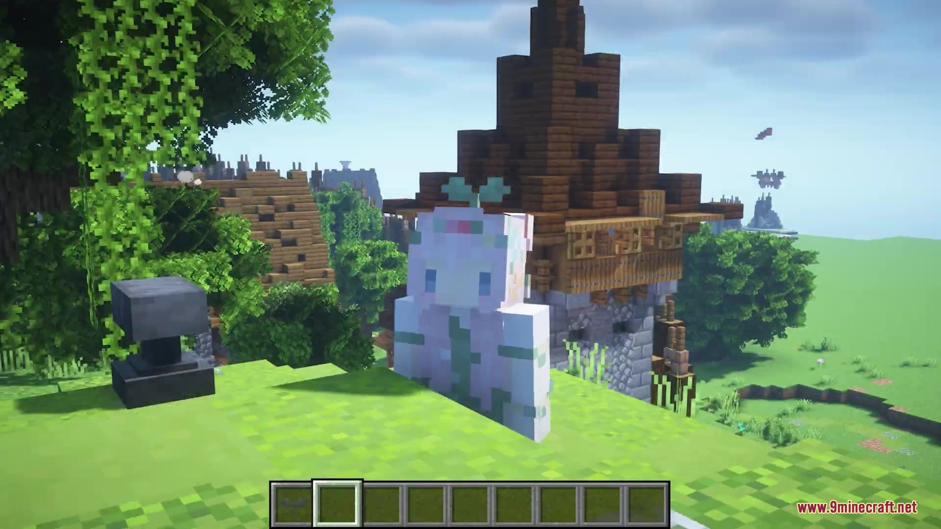 A Minecraft player wearing a tiny green sprout hat standing near an anvil