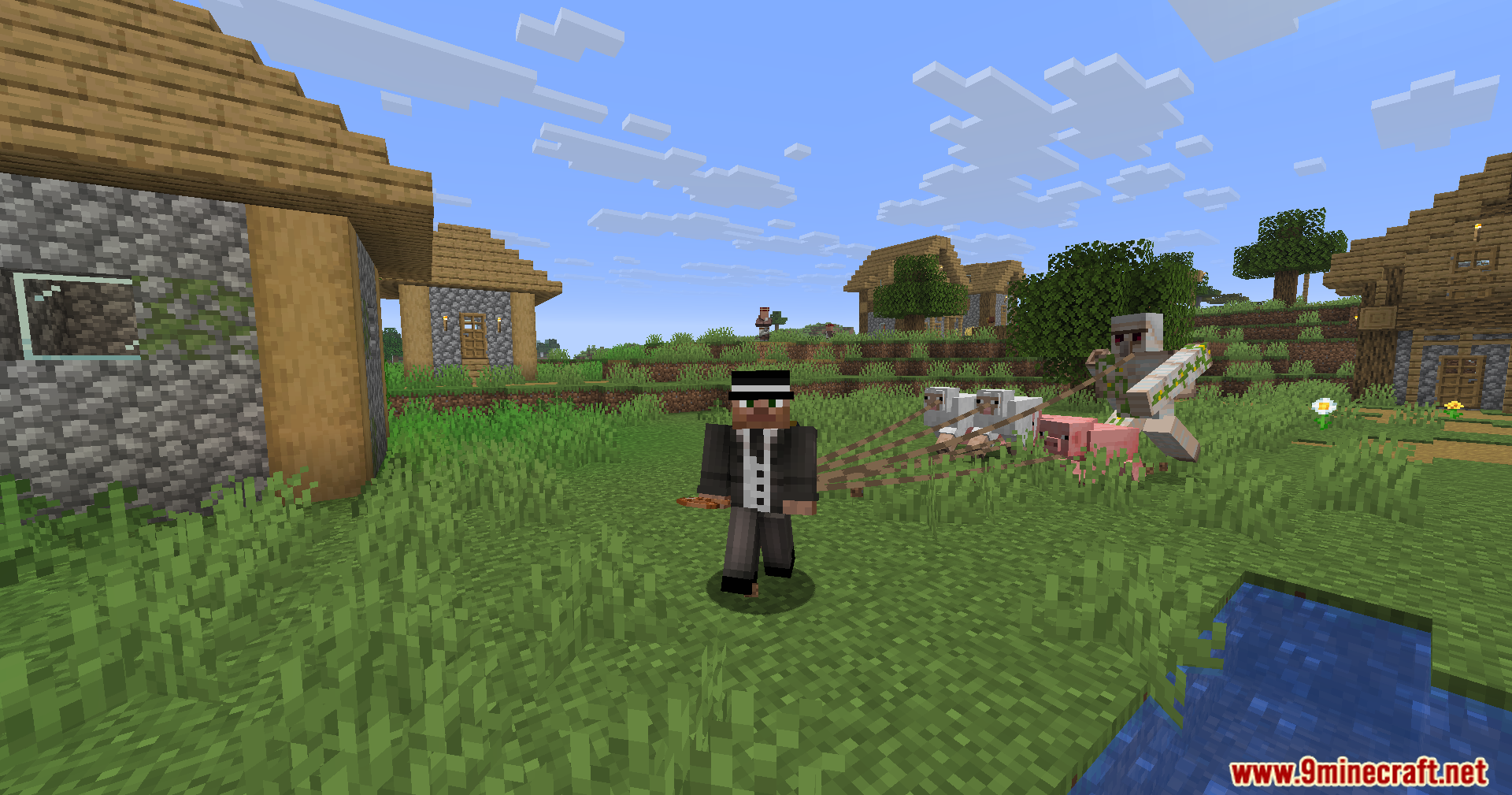 Strong Leads Mod Screenshot 10 Player walking in a village while pulling several animals and an iron golem