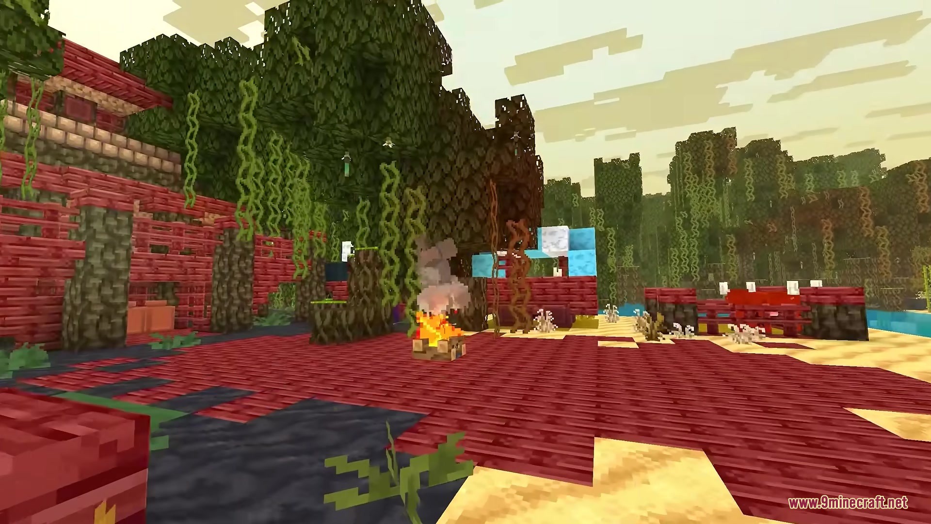 A campfire burning on red wooden planks in a colorful Minecraft forest