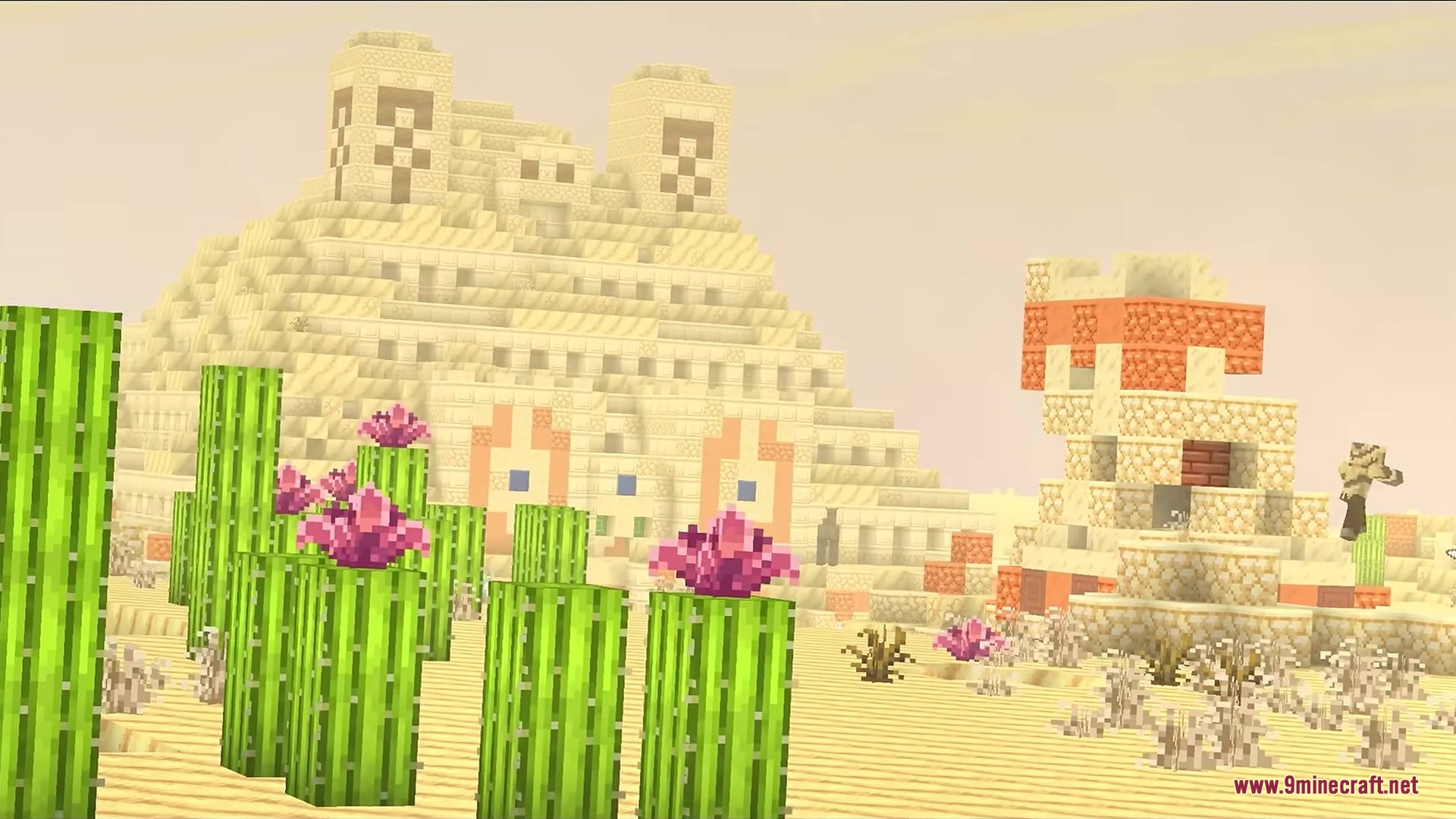 A bright desert biome with a massive sandstone temple and flowering cacti