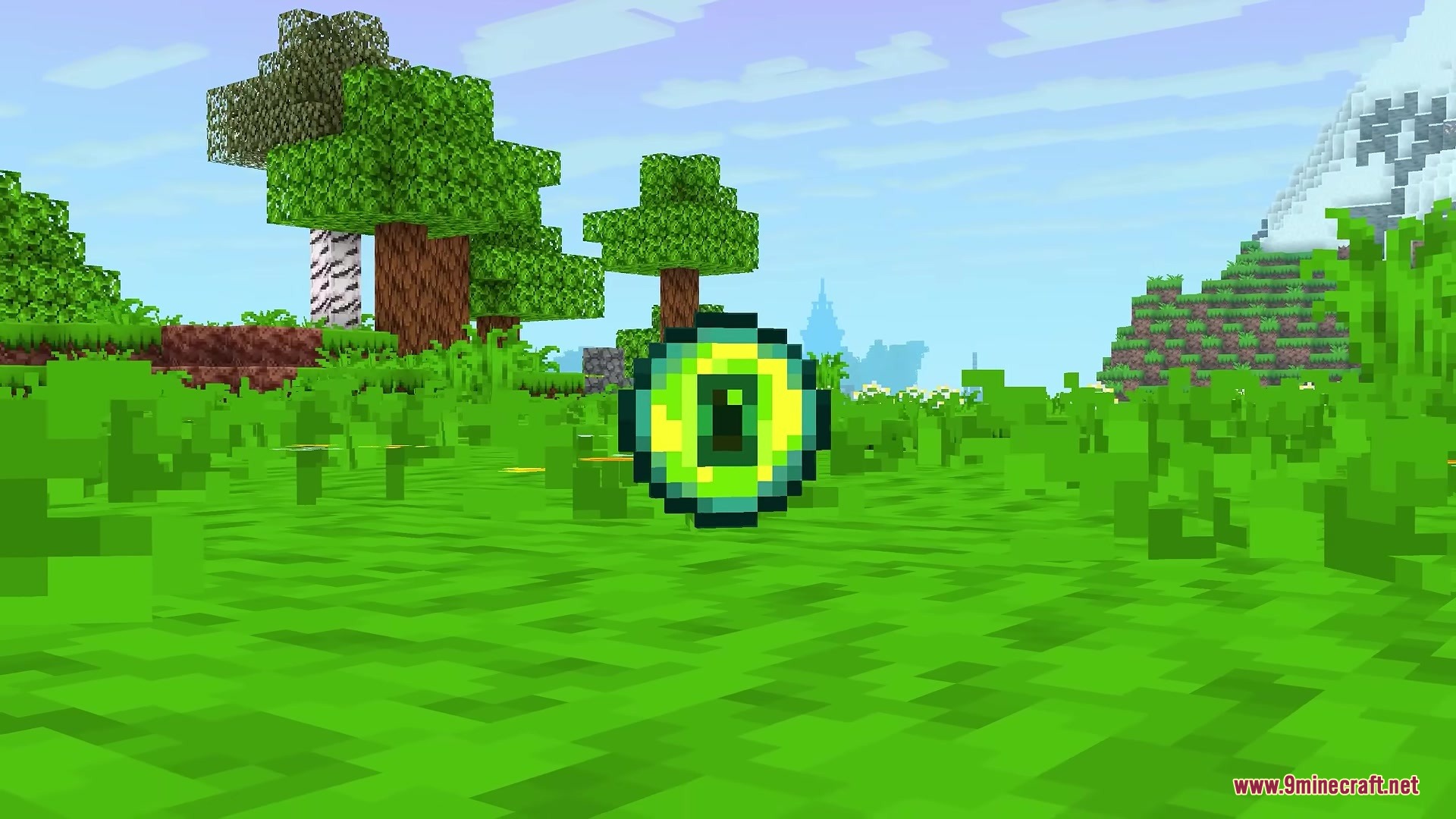 A floating Eye of Ender item in a vibrant and lush forest