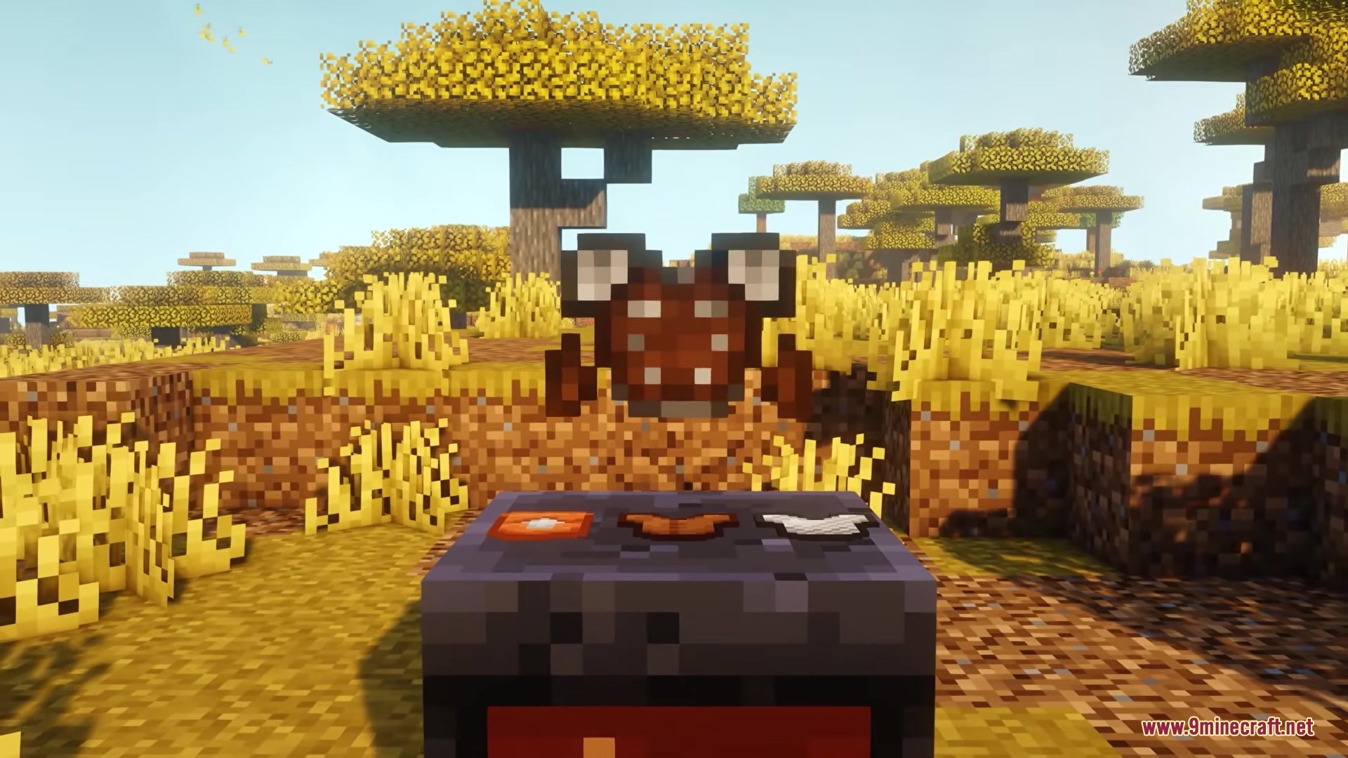 Sulfur Cubes Mod Screenshot 6 Floating sulfur armor item displayed above a smithing table in a savanna biome