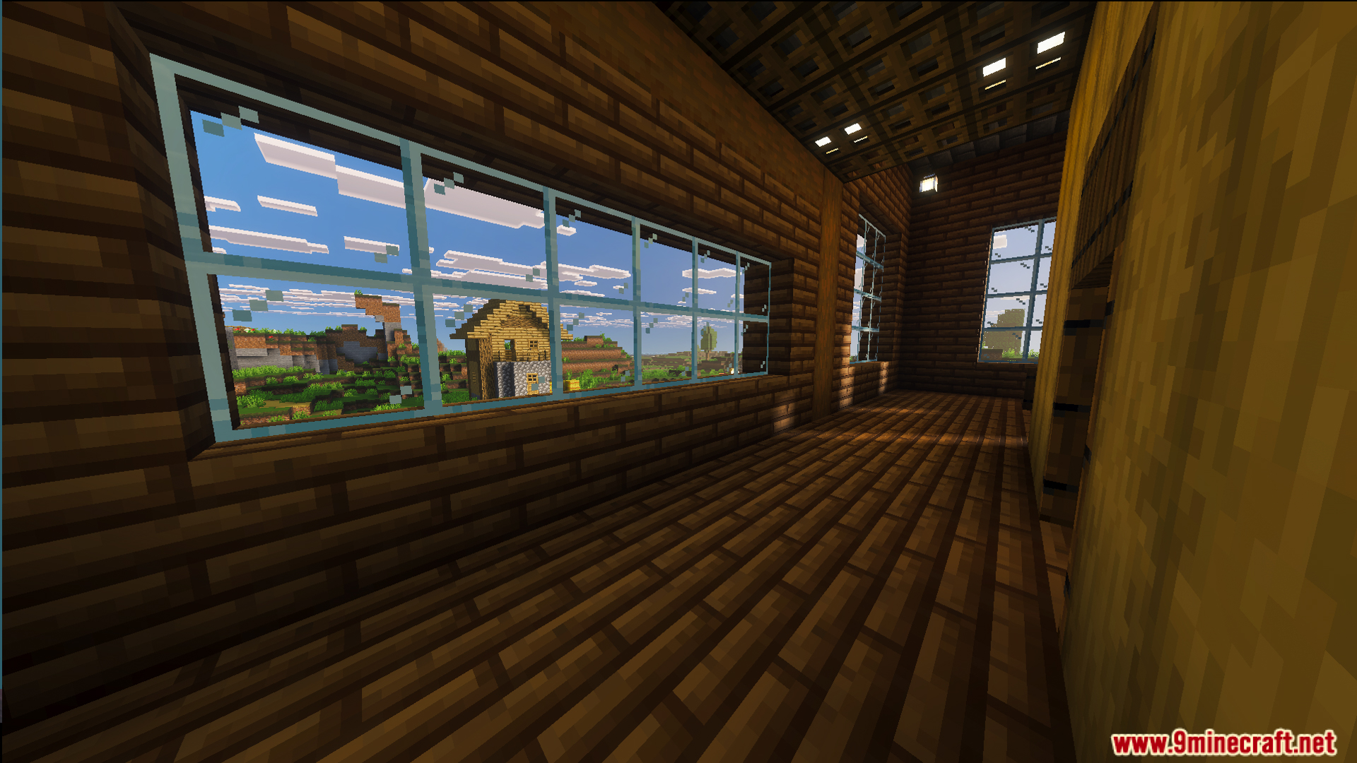Survival Log Cabin House 86 Map Screenshot 8 Large glass windows in a wooden house overlooking a village and green landscape