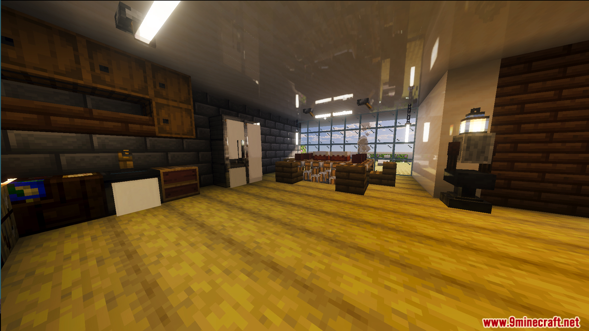 Modern kitchen interior featuring wooden floors and dark stone brick walls