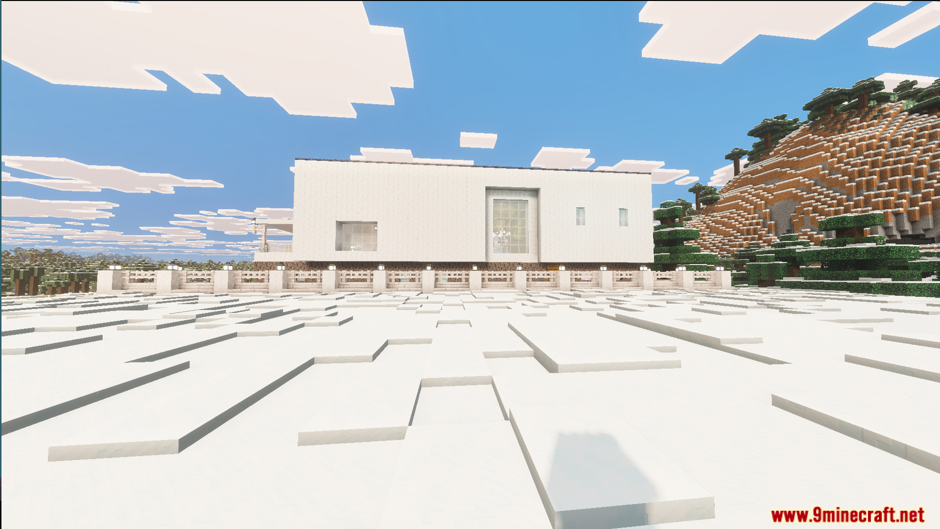 Exterior view of a white modern house located in a snowy biome