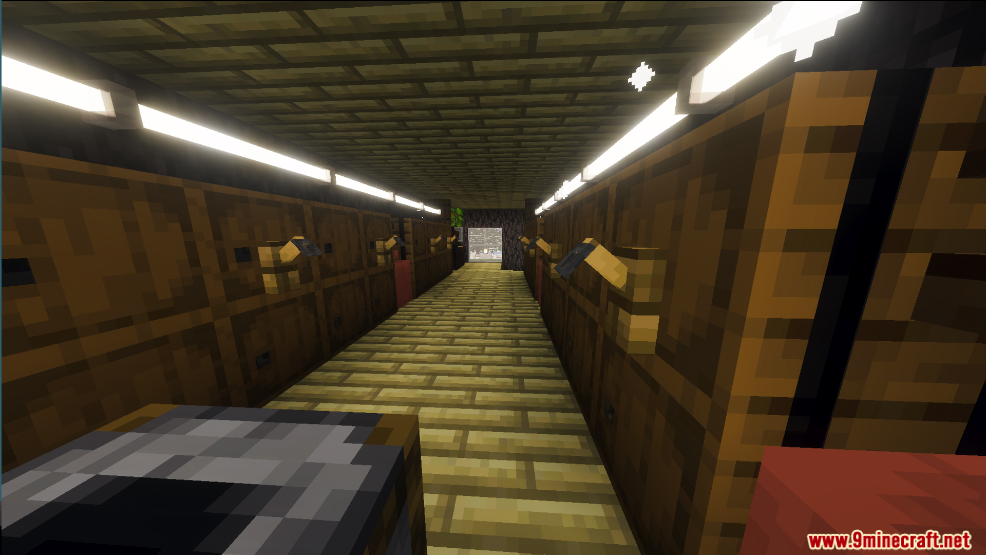 A narrow wooden corridor featuring bright strip lighting and several wall levers