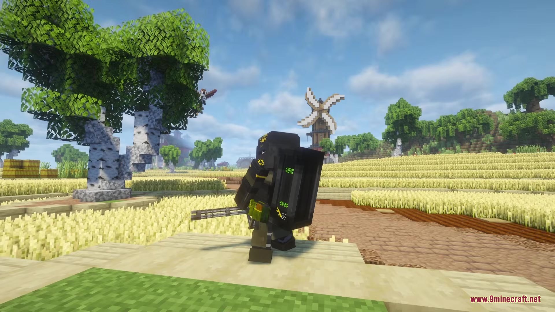 TACZ Juggernaut Armoury Mod Screenshot 2 A character in heavy tactical gear standing near a windmill and birch tree