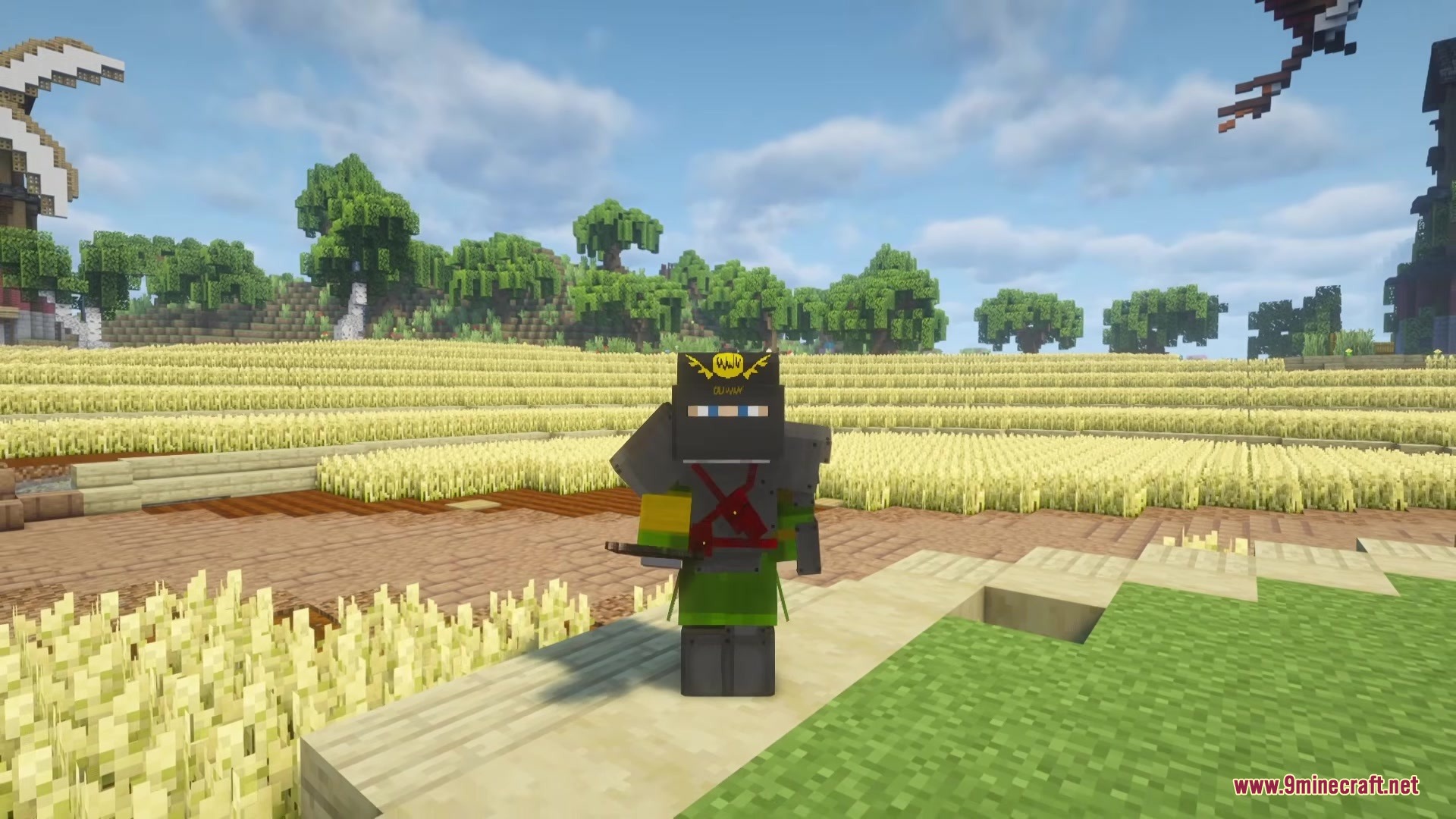 TACZ Juggernaut Armoury Mod Screenshot 5 A Minecraft player wearing heavy Juggernaut tactical armor in a sunny wheat field