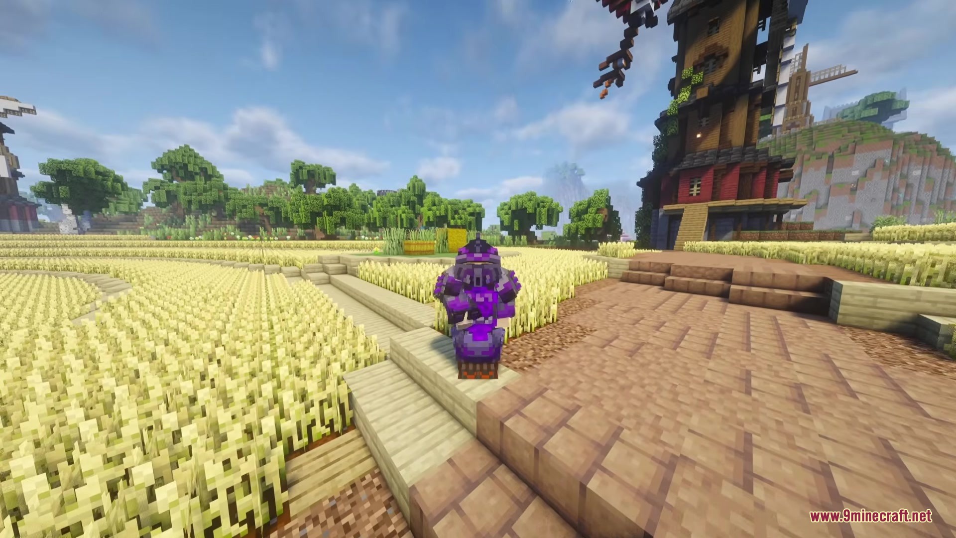 TACZ MORE LEVEL Mod Screenshot 7 Player in purple tactical armor standing in a golden wheat field