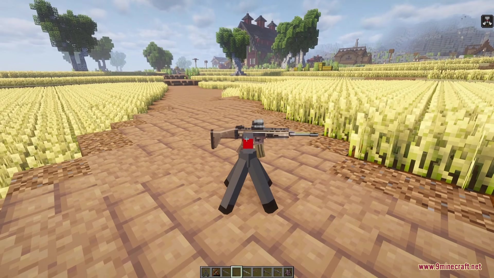 TACZ Turrets Mod Screenshot 1 A TACZ turret with a mounted rifle stands in a field