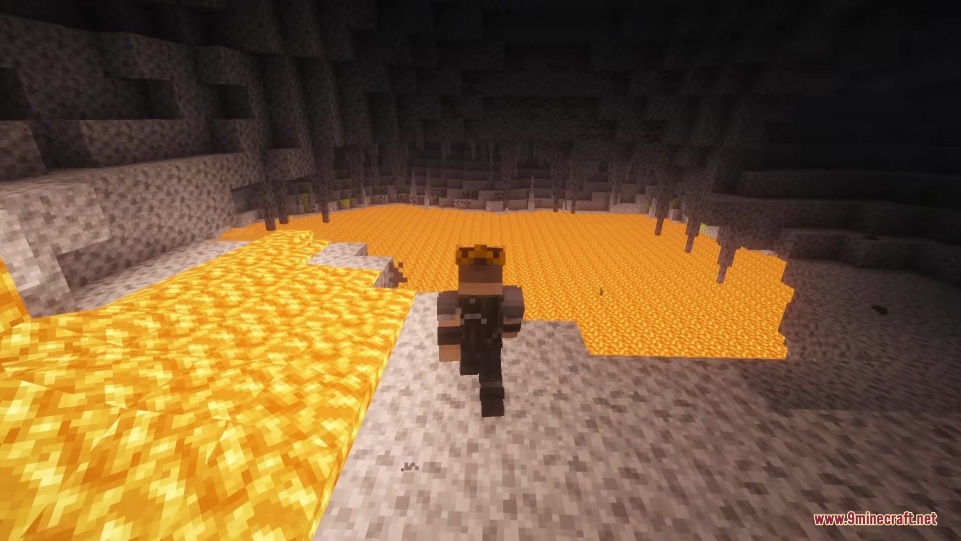 A player looks at a vast lava pool inside a rocky underground cavern