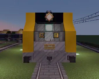 Front view of a yellow and grey Minecraft locomotive on stone tracks