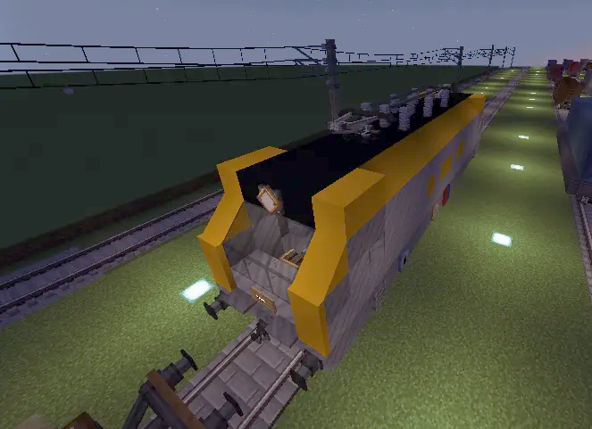 A yellow and grey electric train locomotive parked on a Minecraft railway track