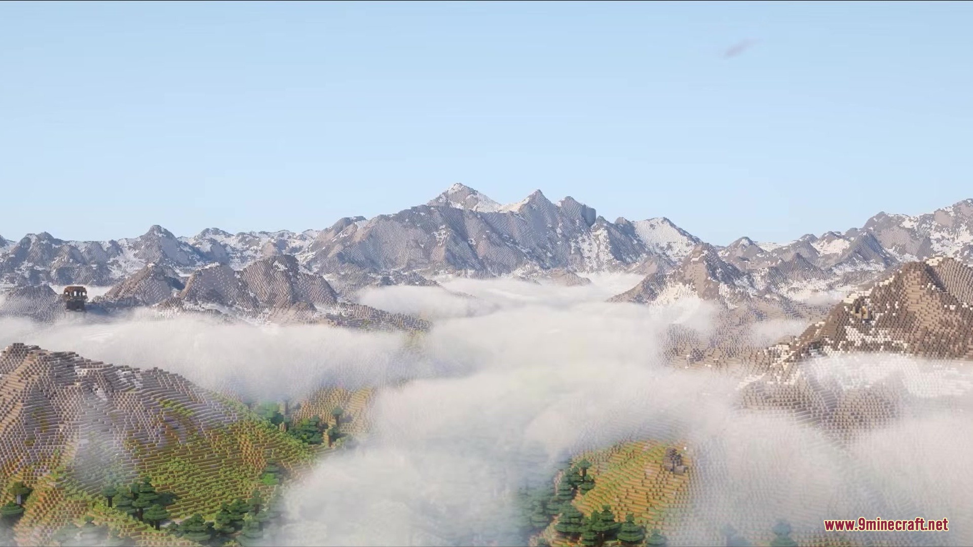 Massive snow capped mountains towering over a sea of white clouds
