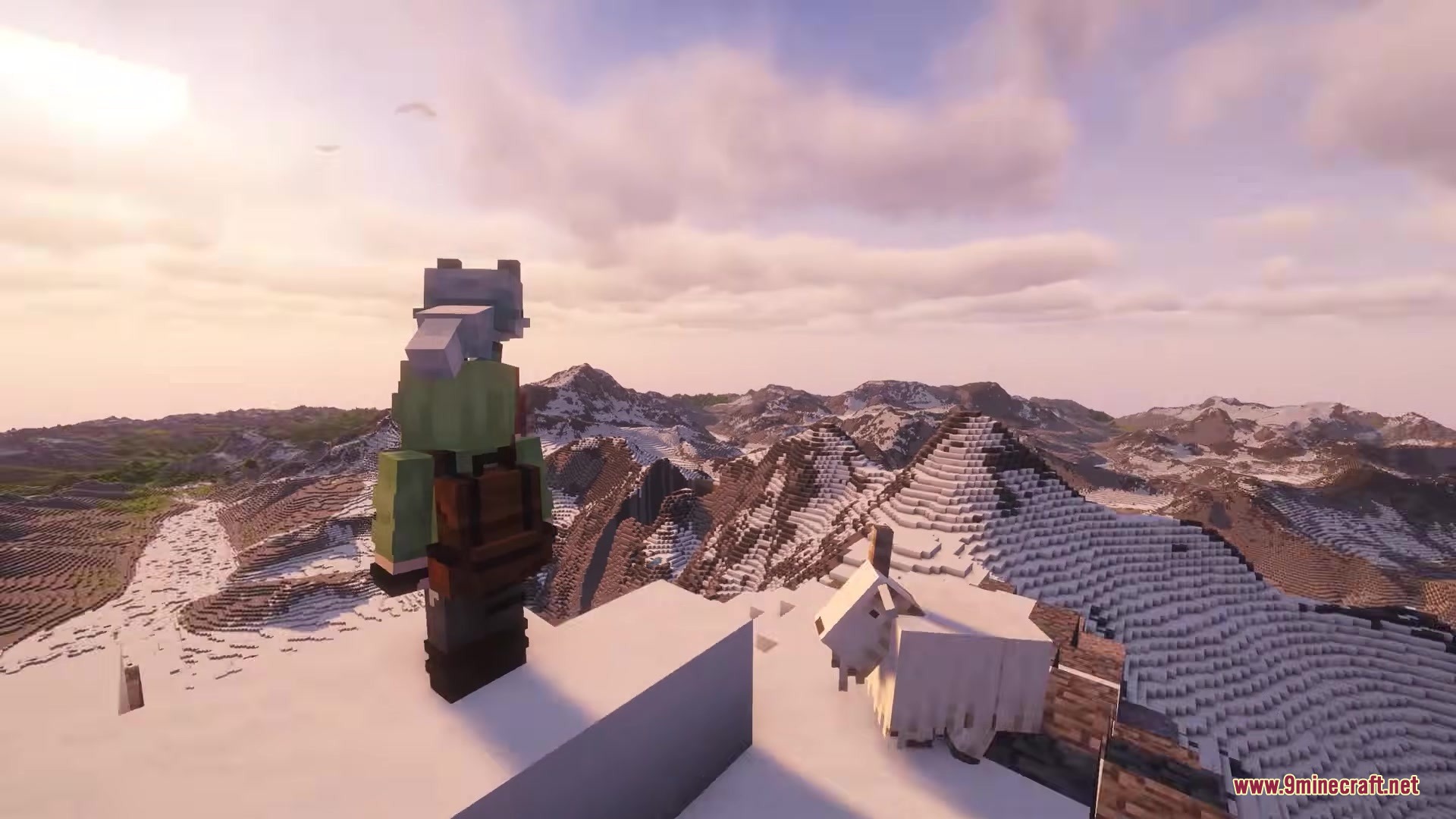 Player standing on a snowy mountain peak next to a goat