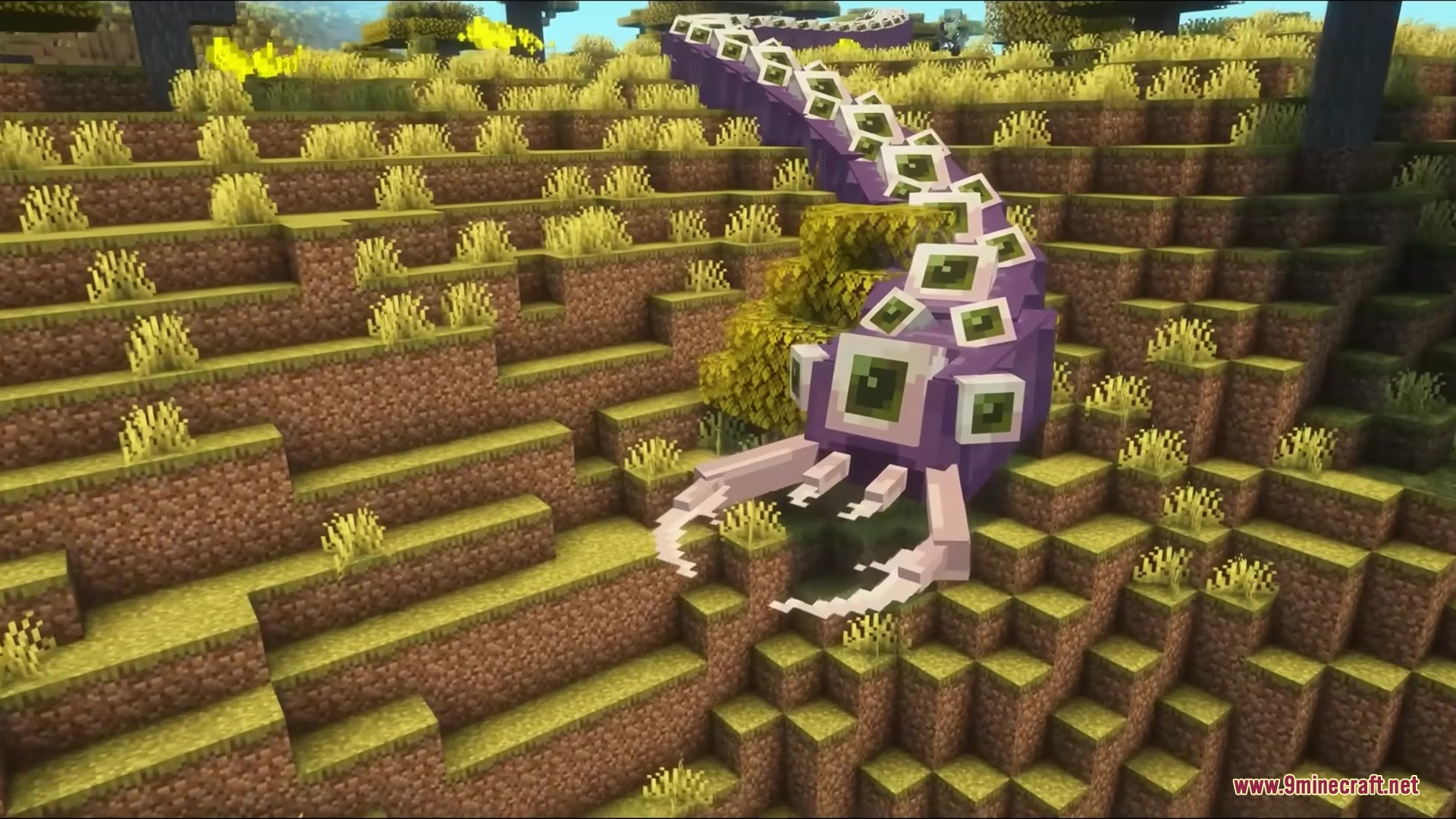 The Eater of Worlds boss crawls down a grassy hill in Minecraft