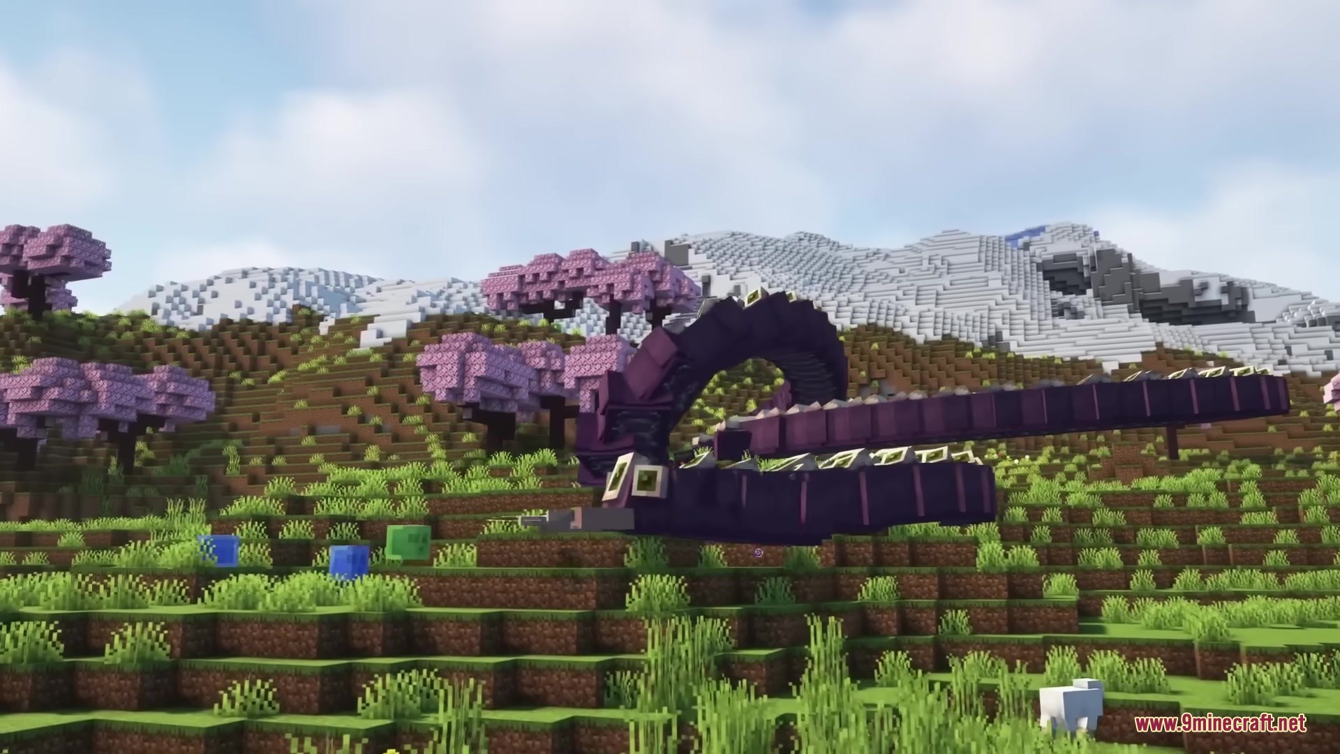 The Eater of Worlds boss crawls across a grassy cherry blossom hill