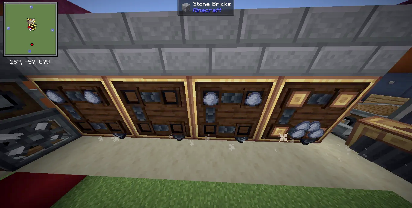 Mechanical crafters processing clay balls along a stone brick wall