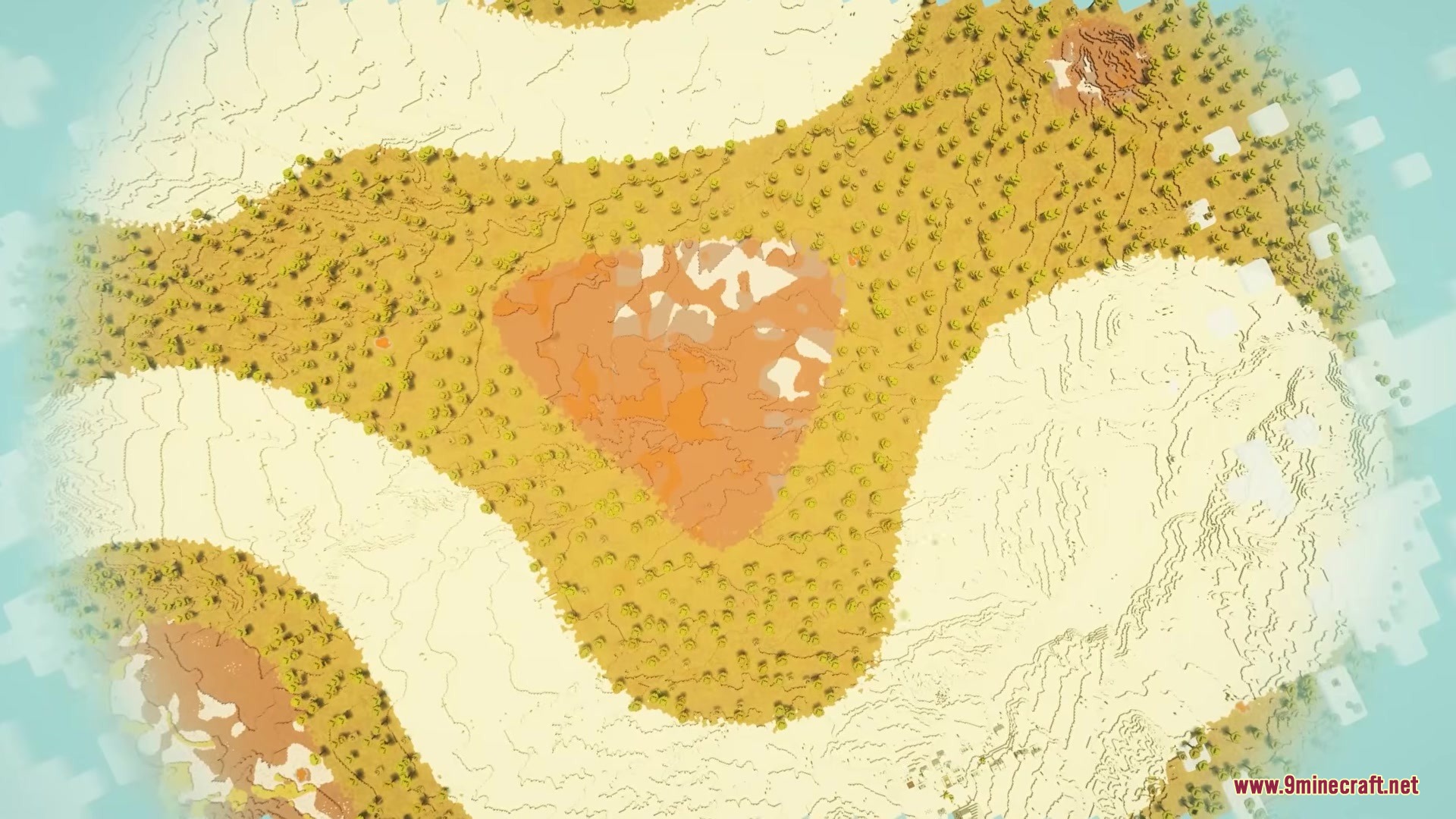 A winding desert landscape with mesa patches and scattered trees from above