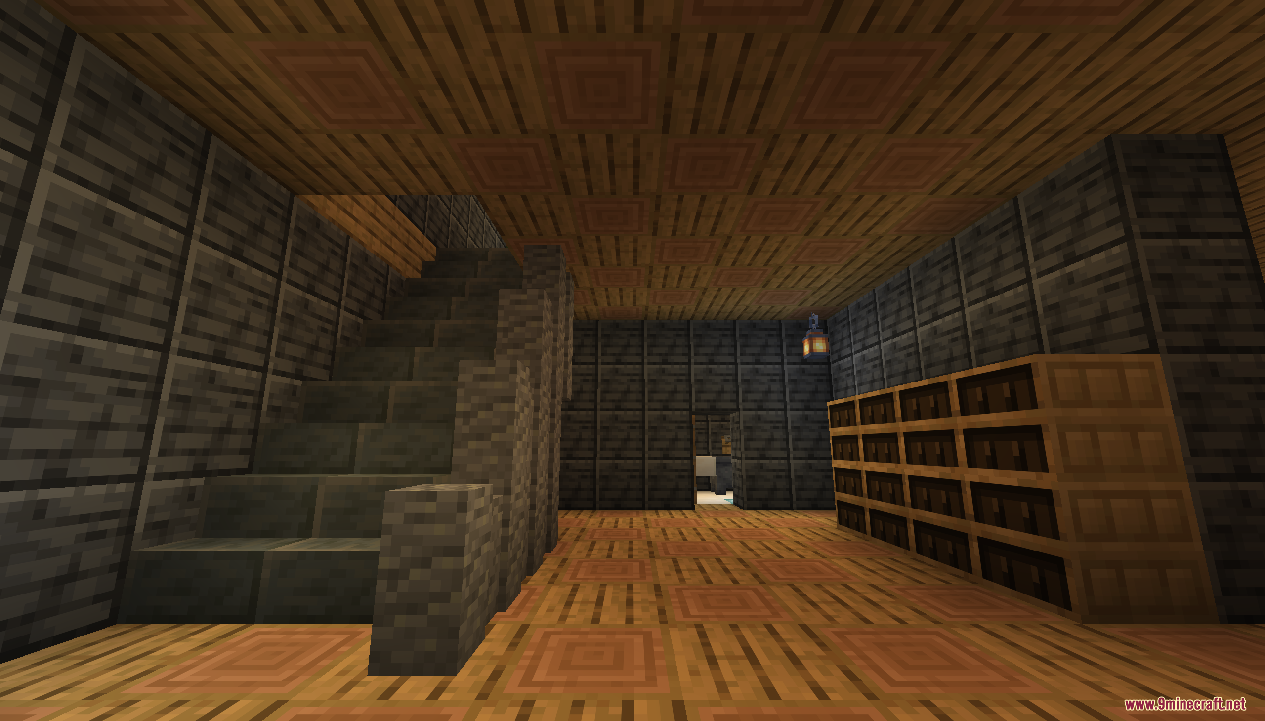A stone staircase leads upward in a room with wooden floors and bookshelves