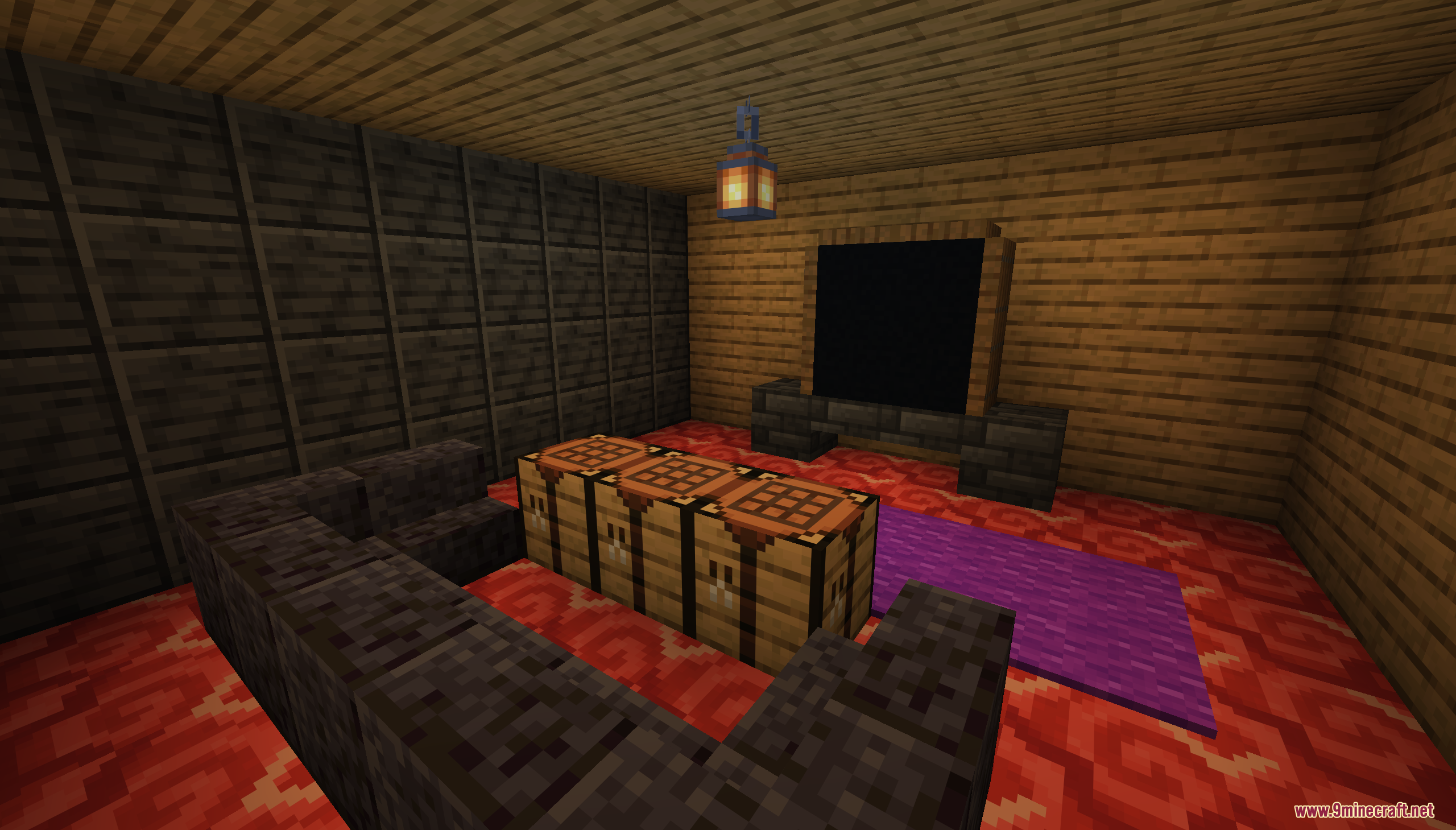 A living room with a dark sofa and a table made of chests
