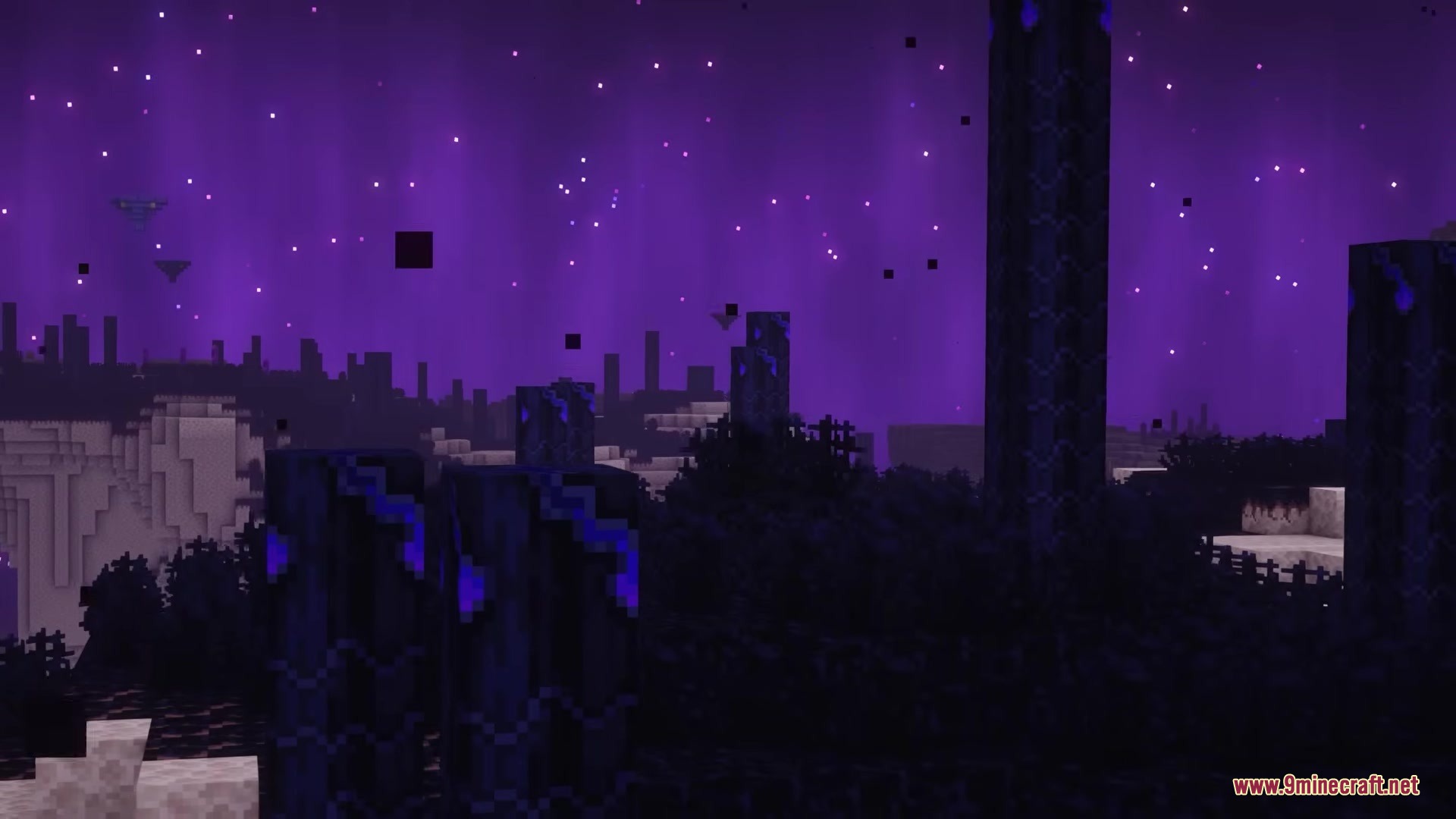 The Beyond Mod Screenshot 17 A vast purple landscape in the End dimension featuring tall dark stone pillars