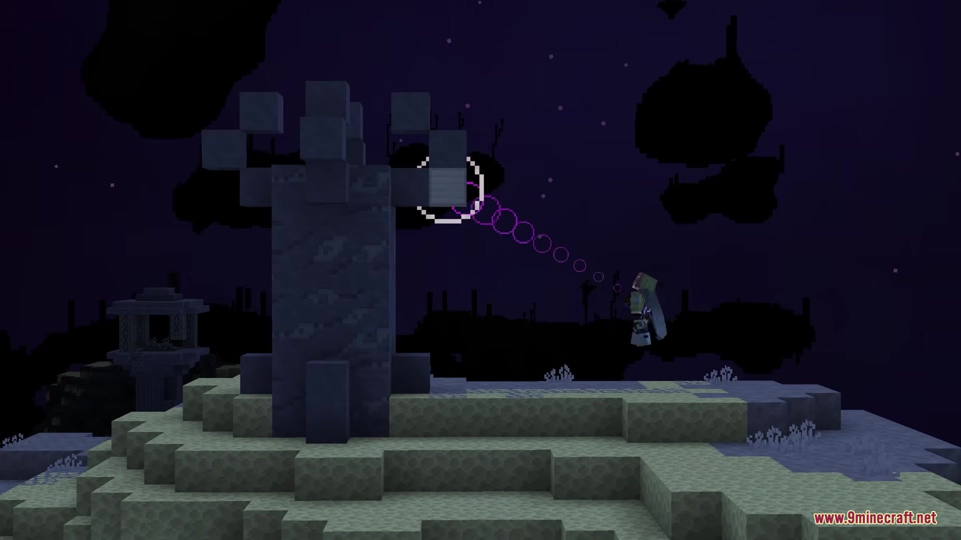 The Beyond Mod Screenshot 2 A player wearing an elytra flies past a tall stone structure in the End