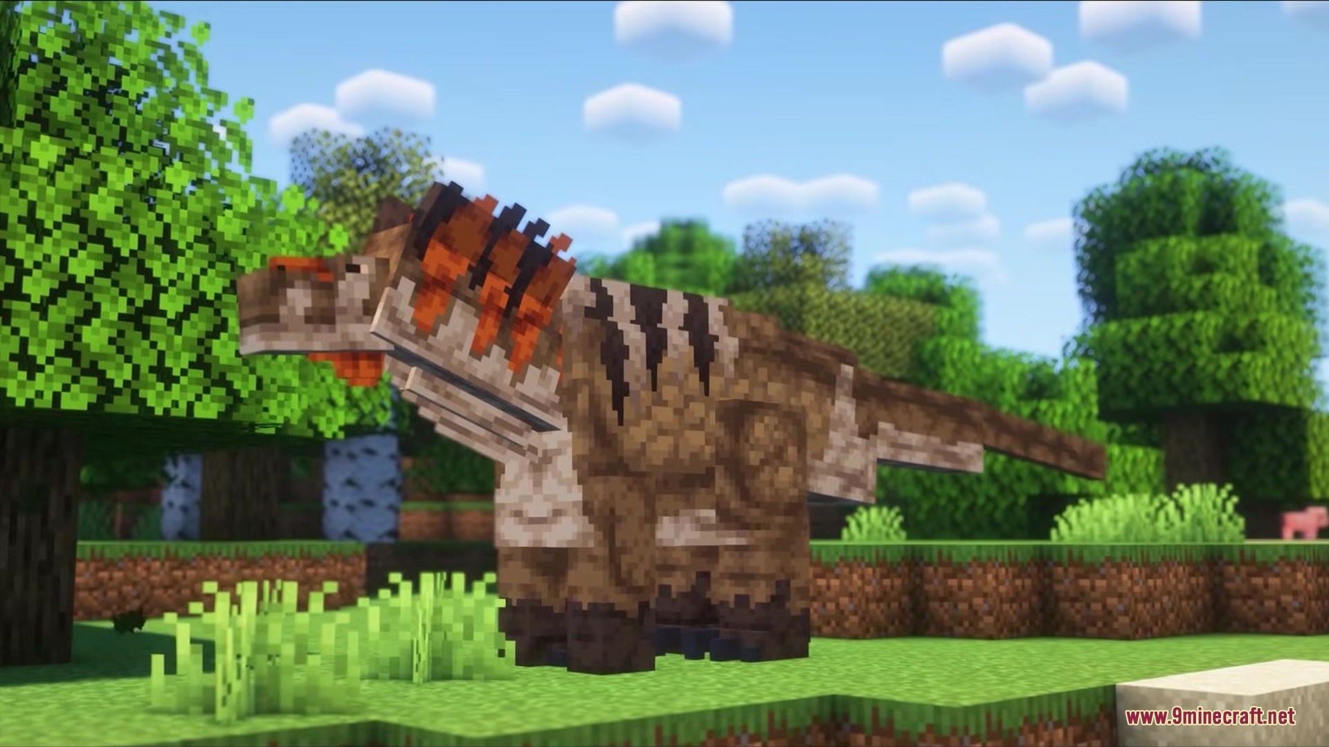 The Past Ages REWORK Mod Screenshot 2 A large prehistoric dinosaur standing in a lush green Minecraft forest