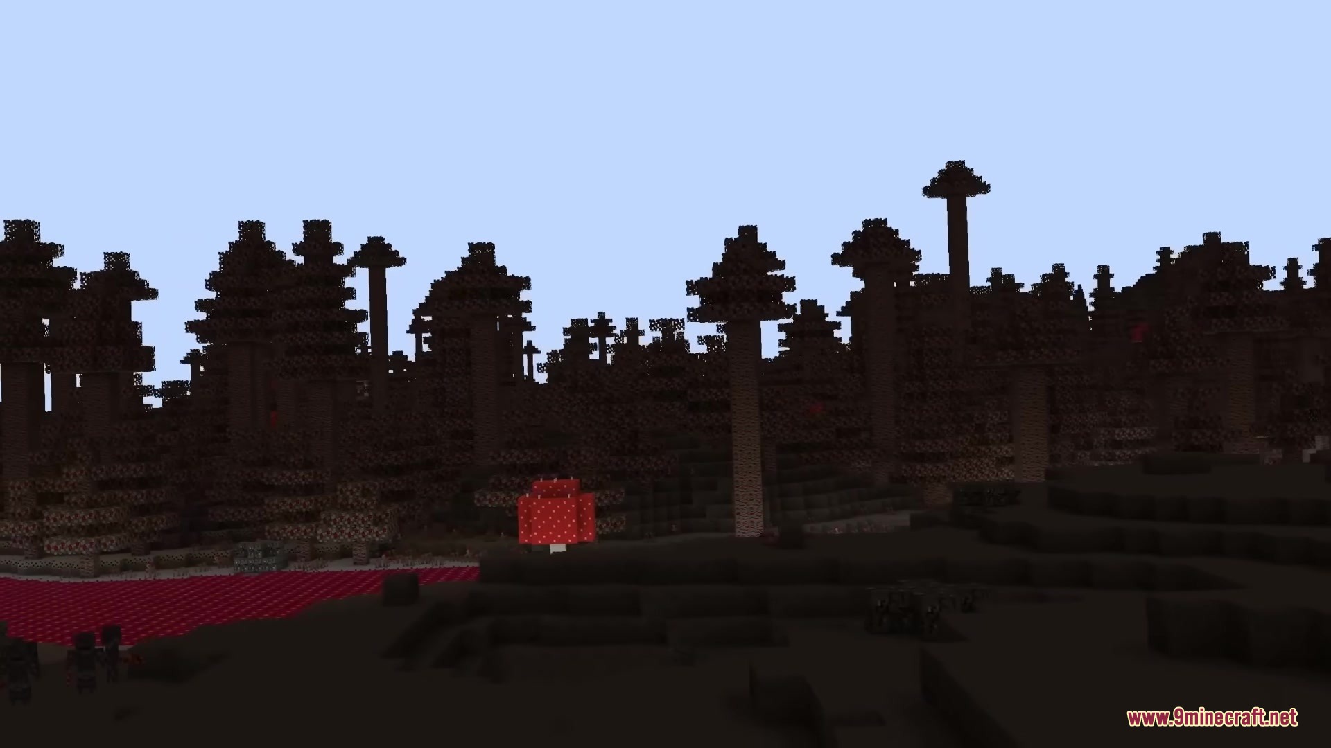 The Shadowlands Mod Screenshot 2 Dark forest biome with tree silhouettes and a bright red mushroom