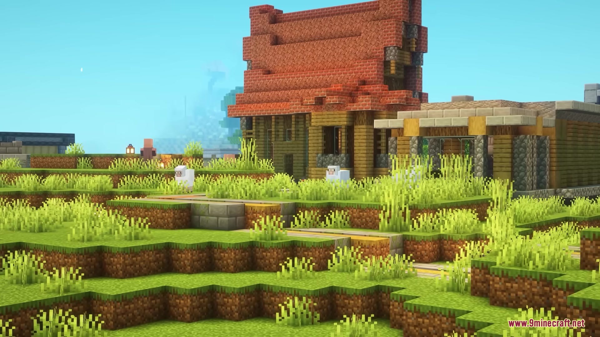 A wooden house with a red roof sits in a grassy village landscape