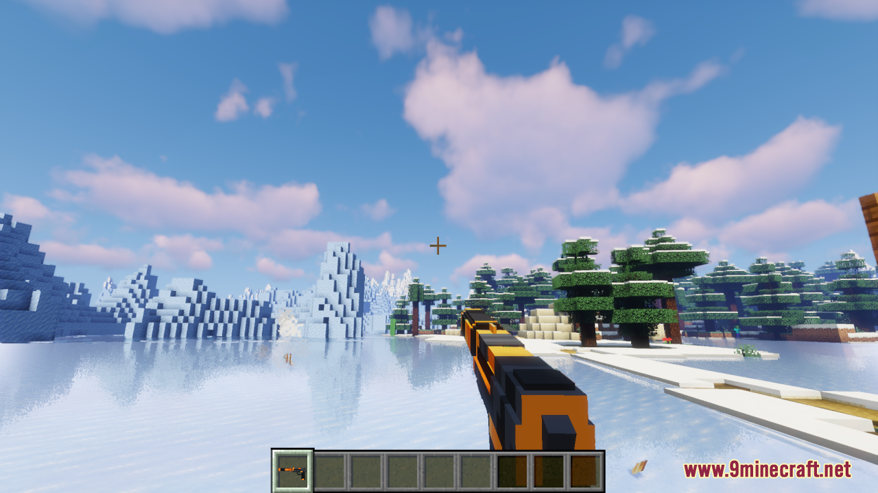 A player holds a custom orange and black gun in a snowy biome