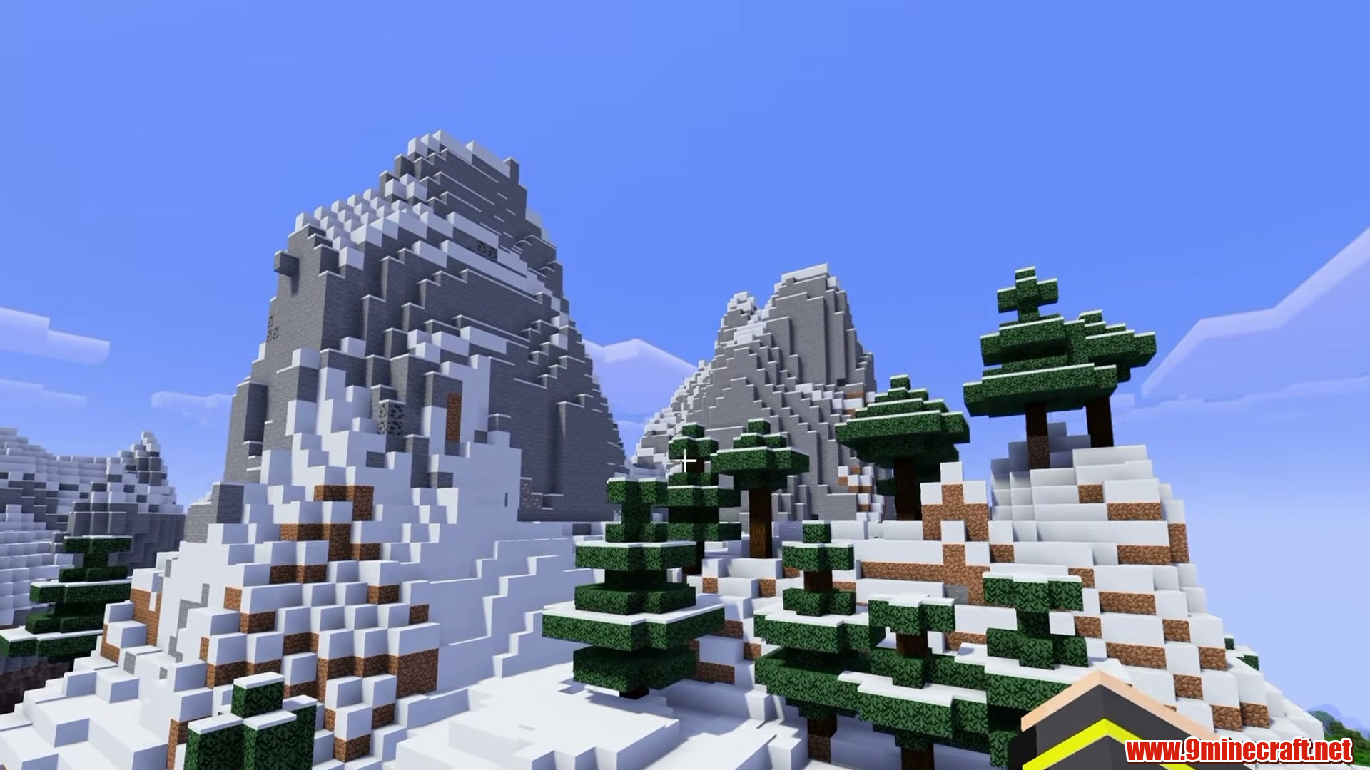Snow-dusted trees on the valley rim